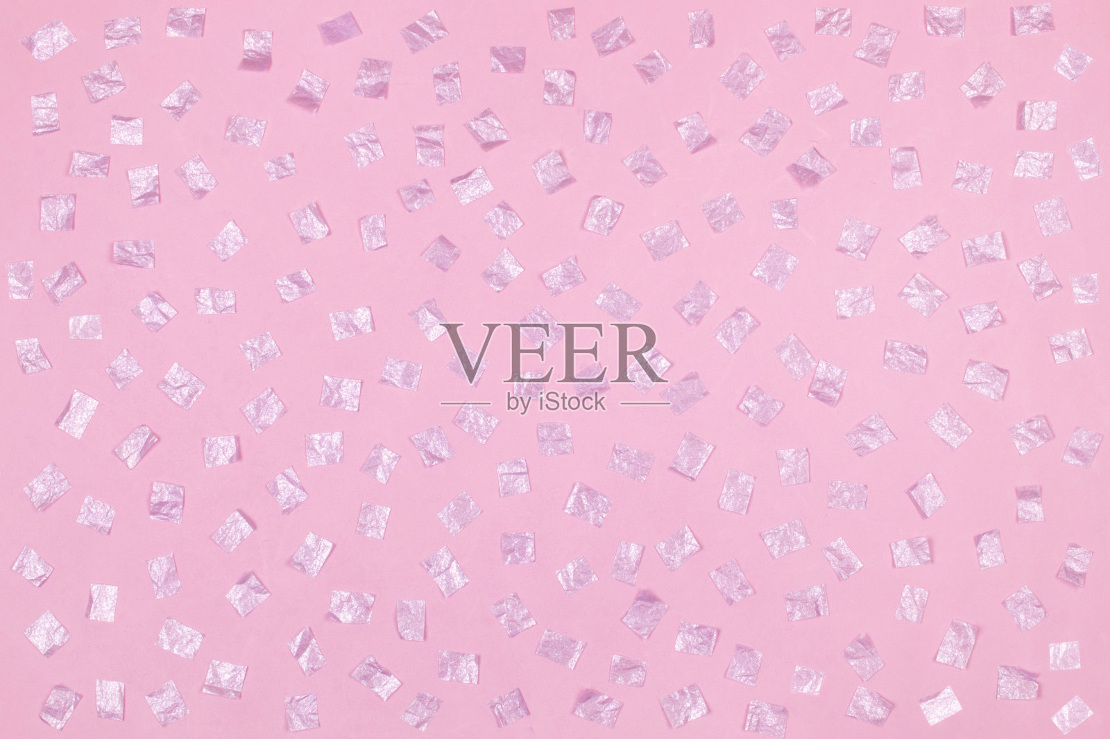 粉红色的方形纸糖果，粉红色的背景照片摄影图片