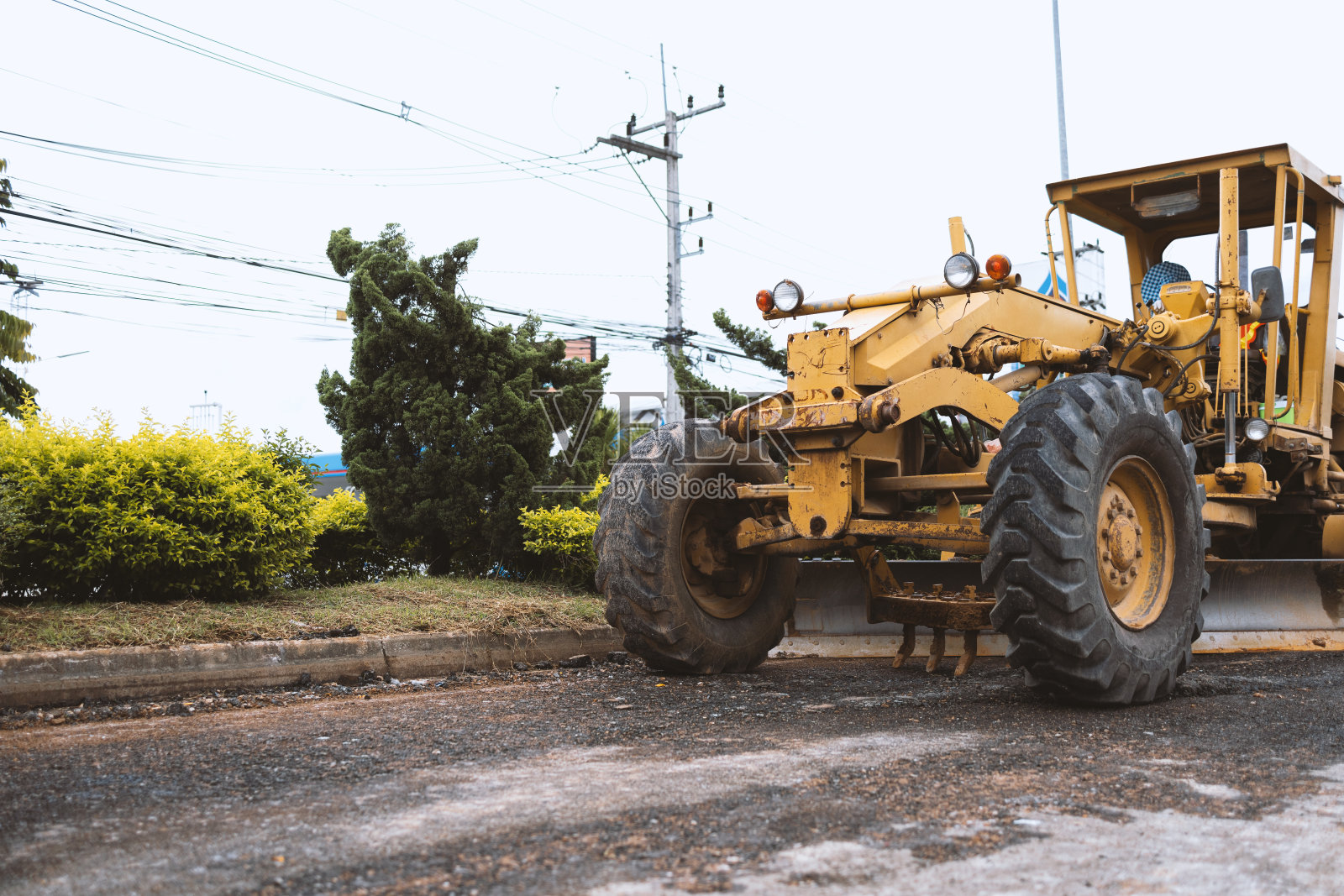 特写挖土机在道路和维修的建筑工程中移除石头照片摄影图片