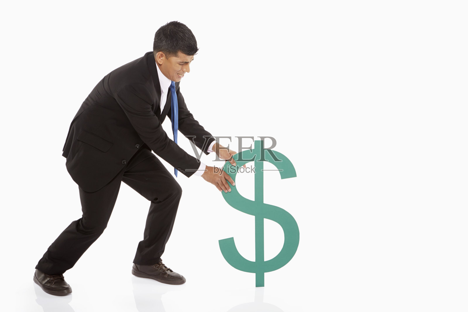拉动美元符号的商人照片摄影图片