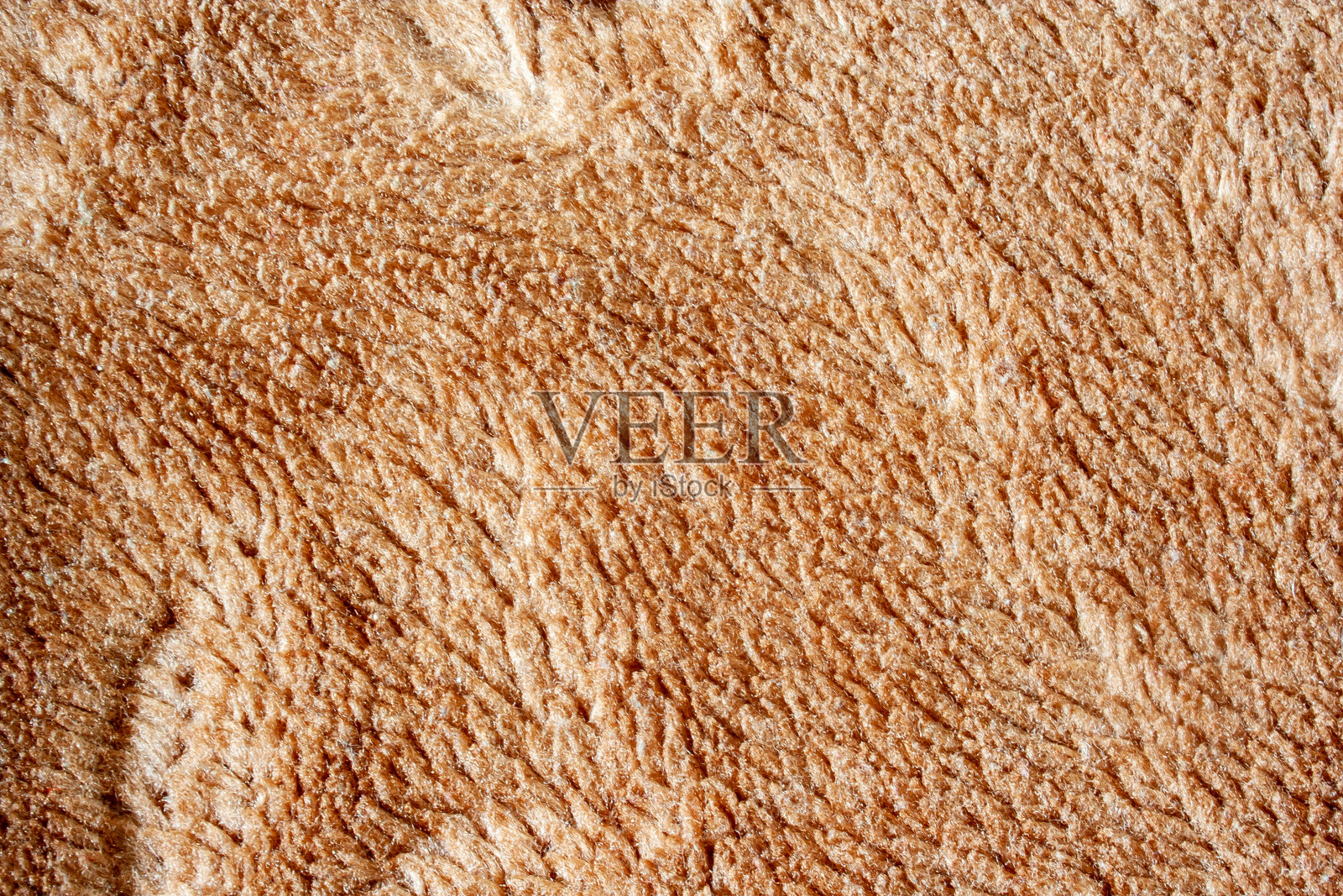 橙色毛巾地毯的纹理背景。橙色地毯的纹理。抽象的装饰。照片摄影图片