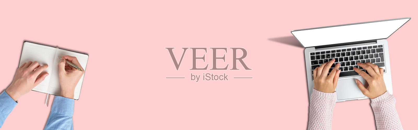 团队合作的概念。女孩用笔记本电脑，男人用笔记本写字。照片摄影图片