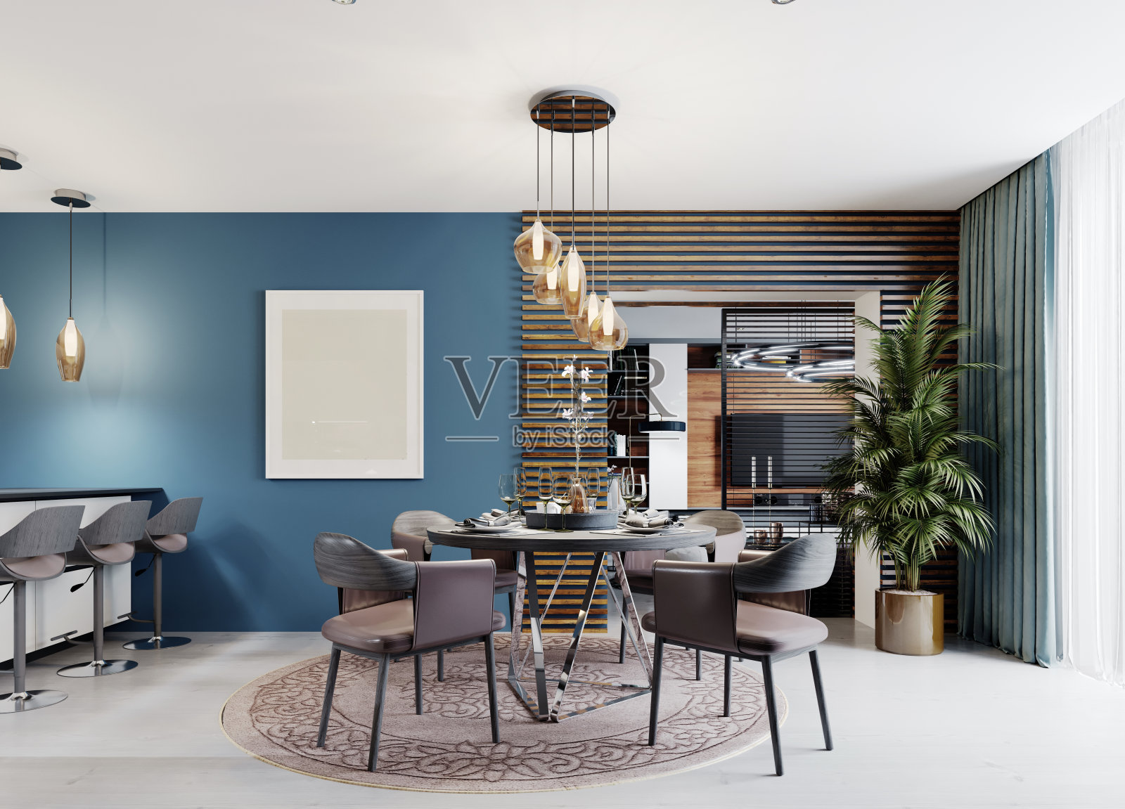 设计师的圆形餐桌与四把椅子和一个吊灯上方的桌子在一个现代化的厨房内部。照片摄影图片