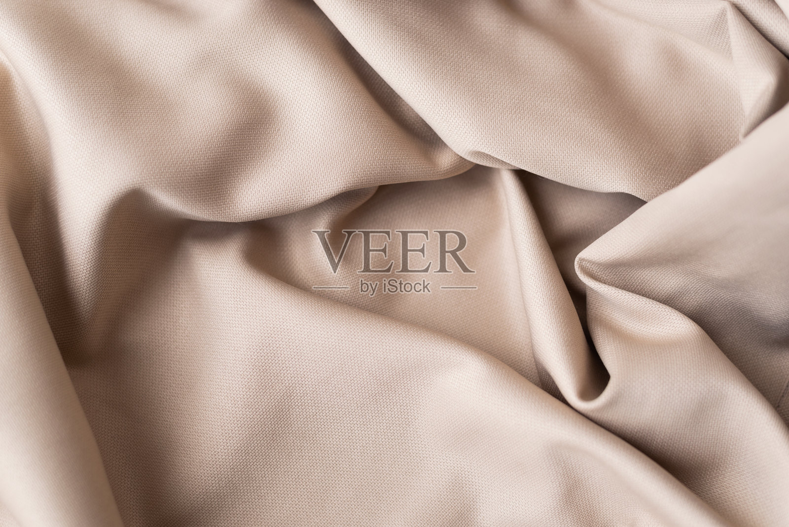 抽象的背景豪华布料或液体波浪或波浪皱褶的grunge丝绸纹理缎天鹅绒材料或豪华的圣诞节背景或优雅的墙纸设计，米色背景照片摄影图片