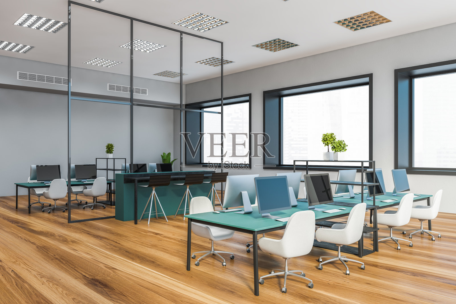 灰色的开放式办公室角落里有蓝色的桌子照片摄影图片