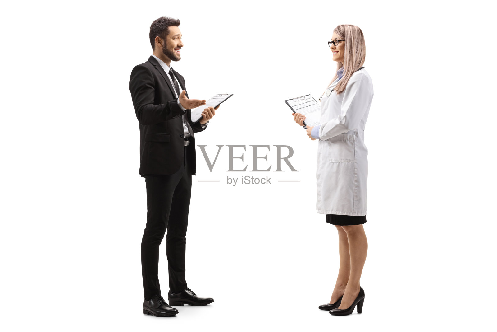 一个商人站着和一个女医生说话的完整的侧面照片照片摄影图片