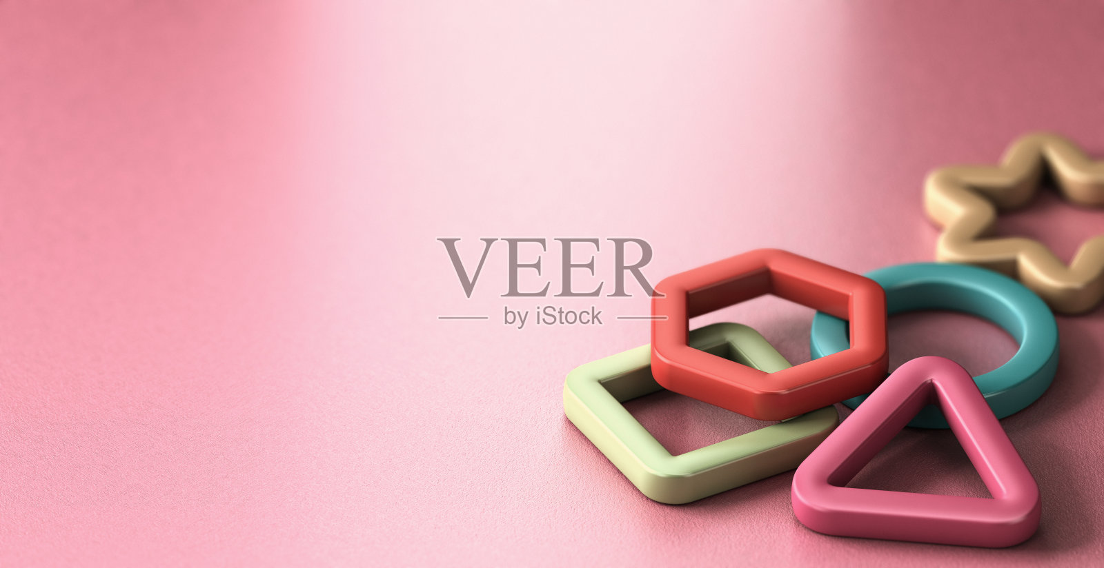 儿童教育，粉色背景上的基本形状。照片摄影图片