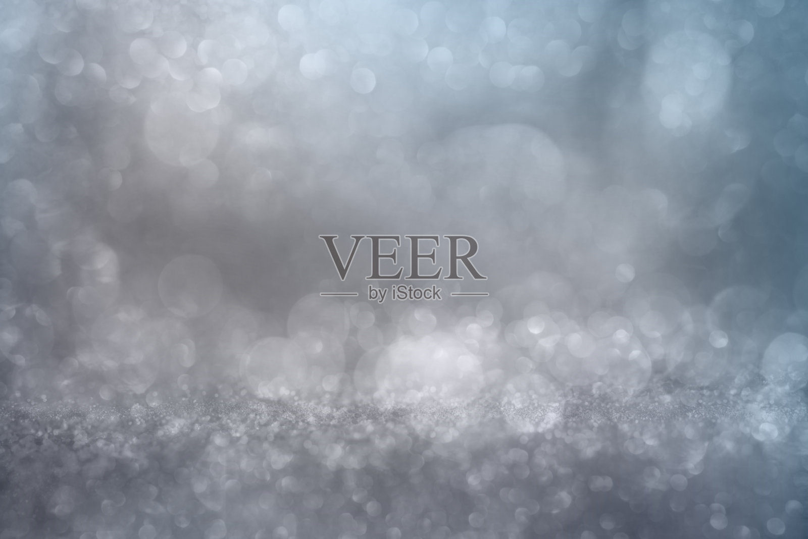 散景效果在银色闪光的背景上照片摄影图片