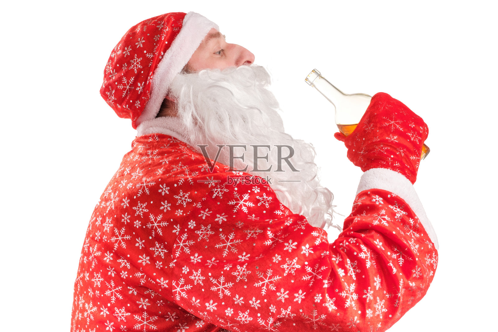 圣诞老人用瓶颈喝酒照片摄影图片