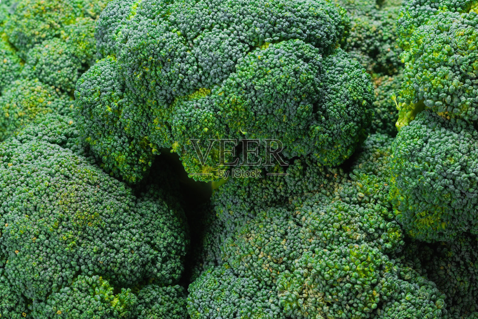 新鲜美味的西兰花背景。照片摄影图片