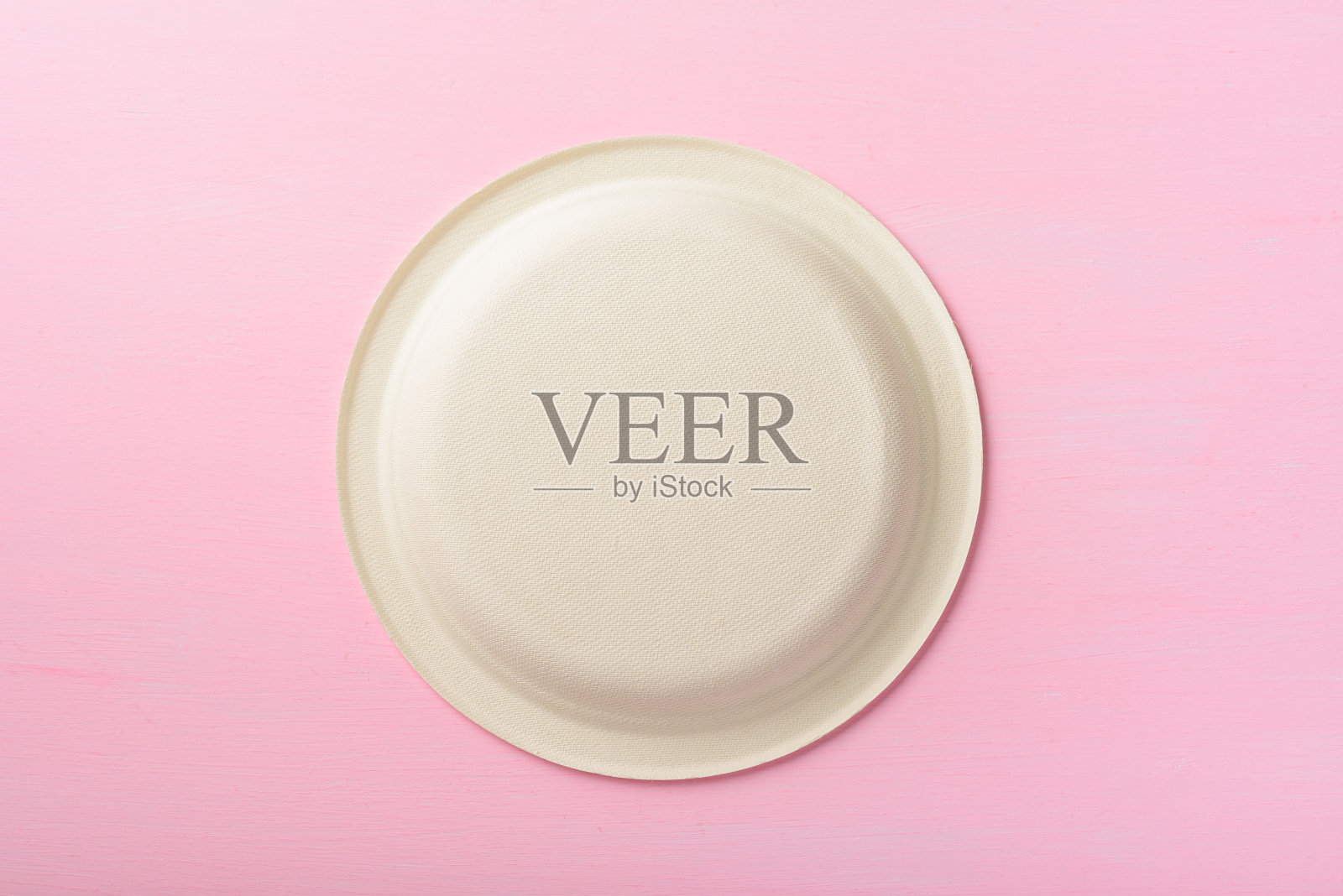 可生物降解板，粉红色背景照片摄影图片