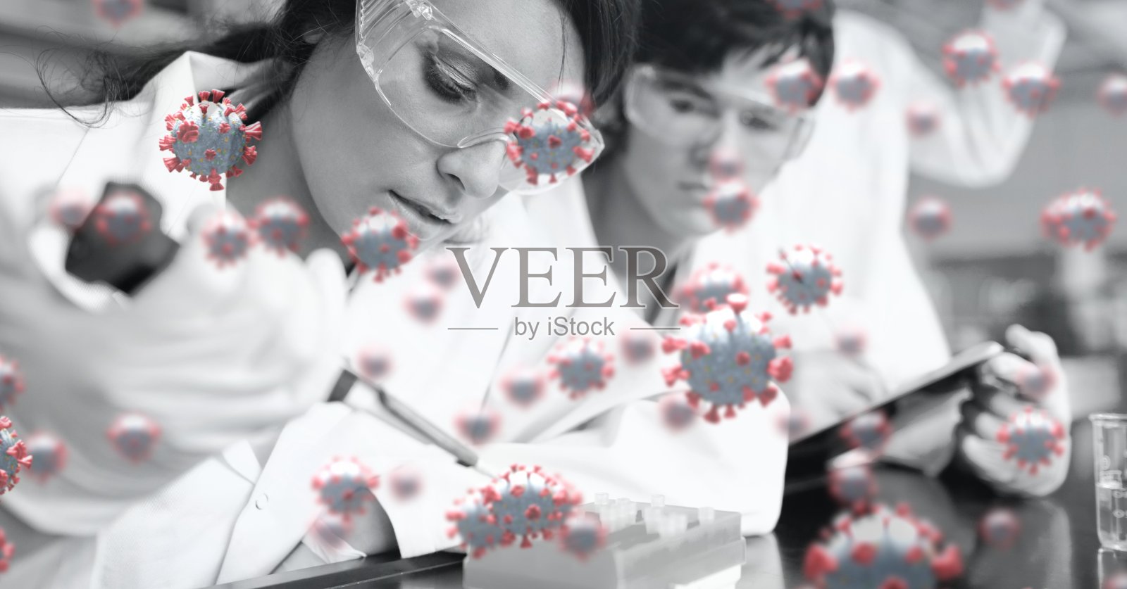 Covid-19细胞对抗在实验室工作的科学家小组照片摄影图片