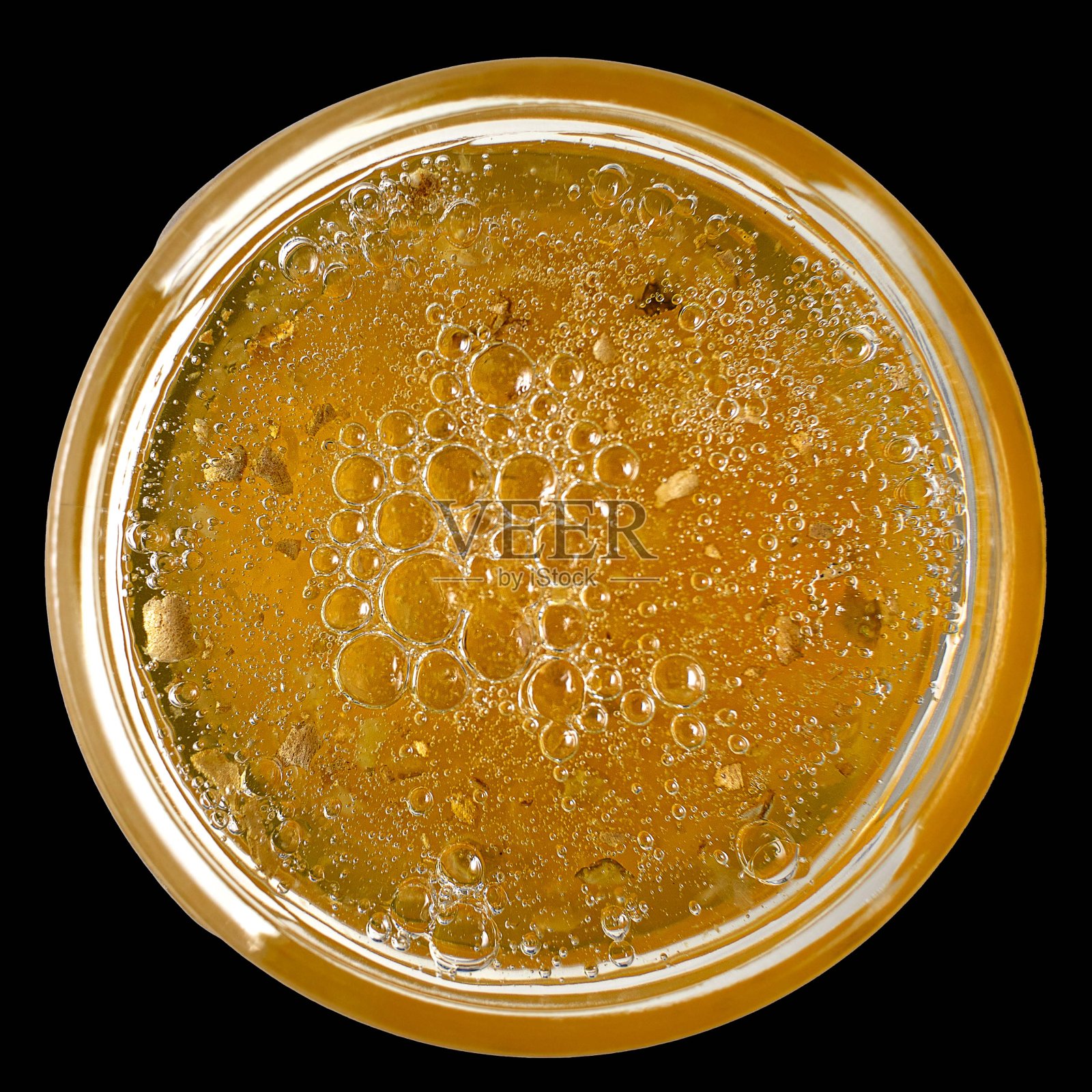 黑色背景上的黄色果酱罐，俯视图照片摄影图片