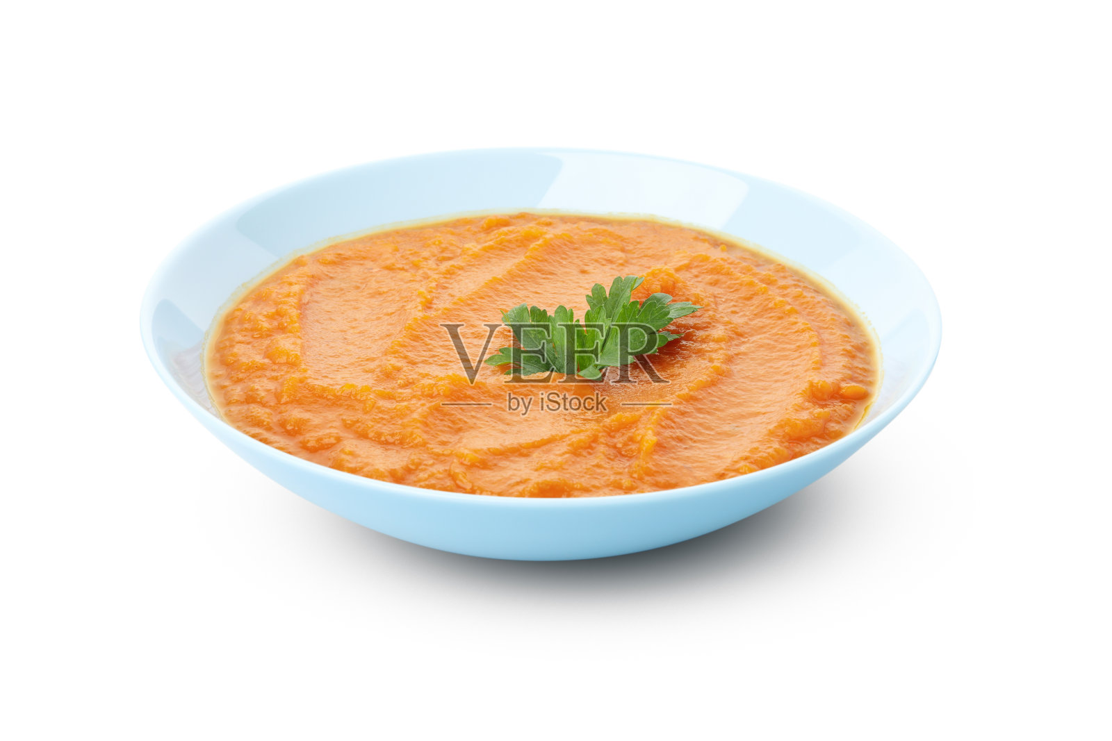 一碗孤立在白色背景上的南瓜汤照片摄影图片