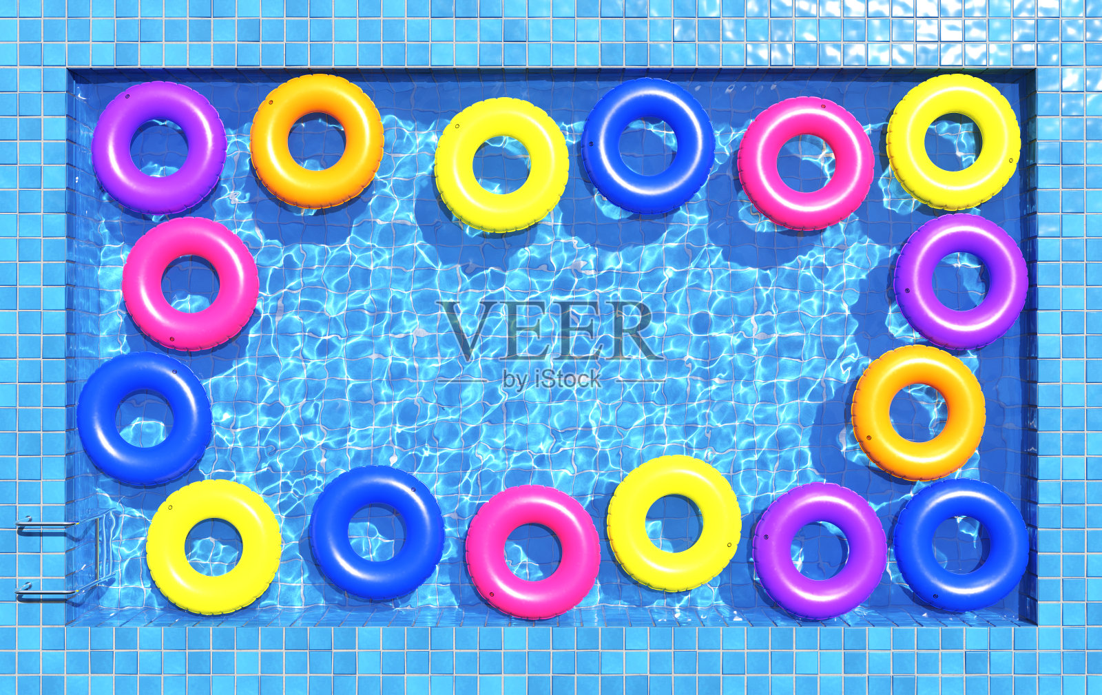 游泳池里五颜六色的游泳圈。泳池派对，夏日背景。俯视图照片摄影图片