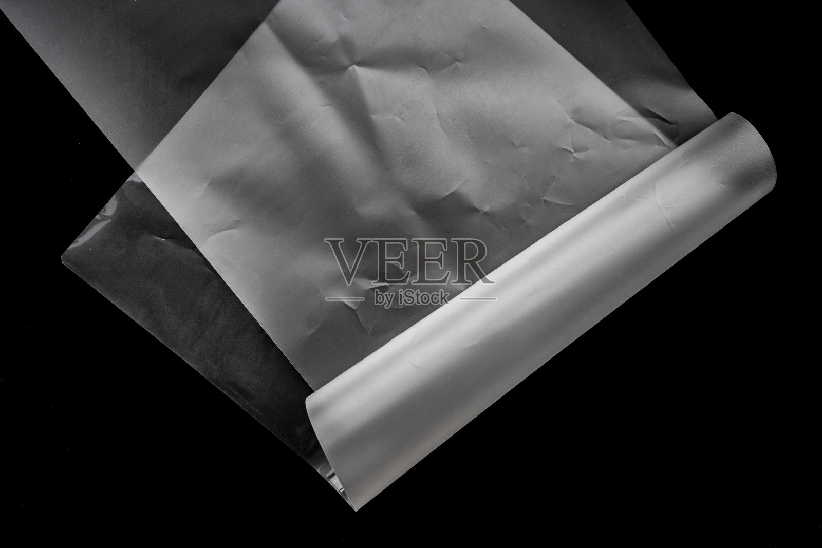 皱纹层压纸纹理覆盖在黑色照片摄影图片