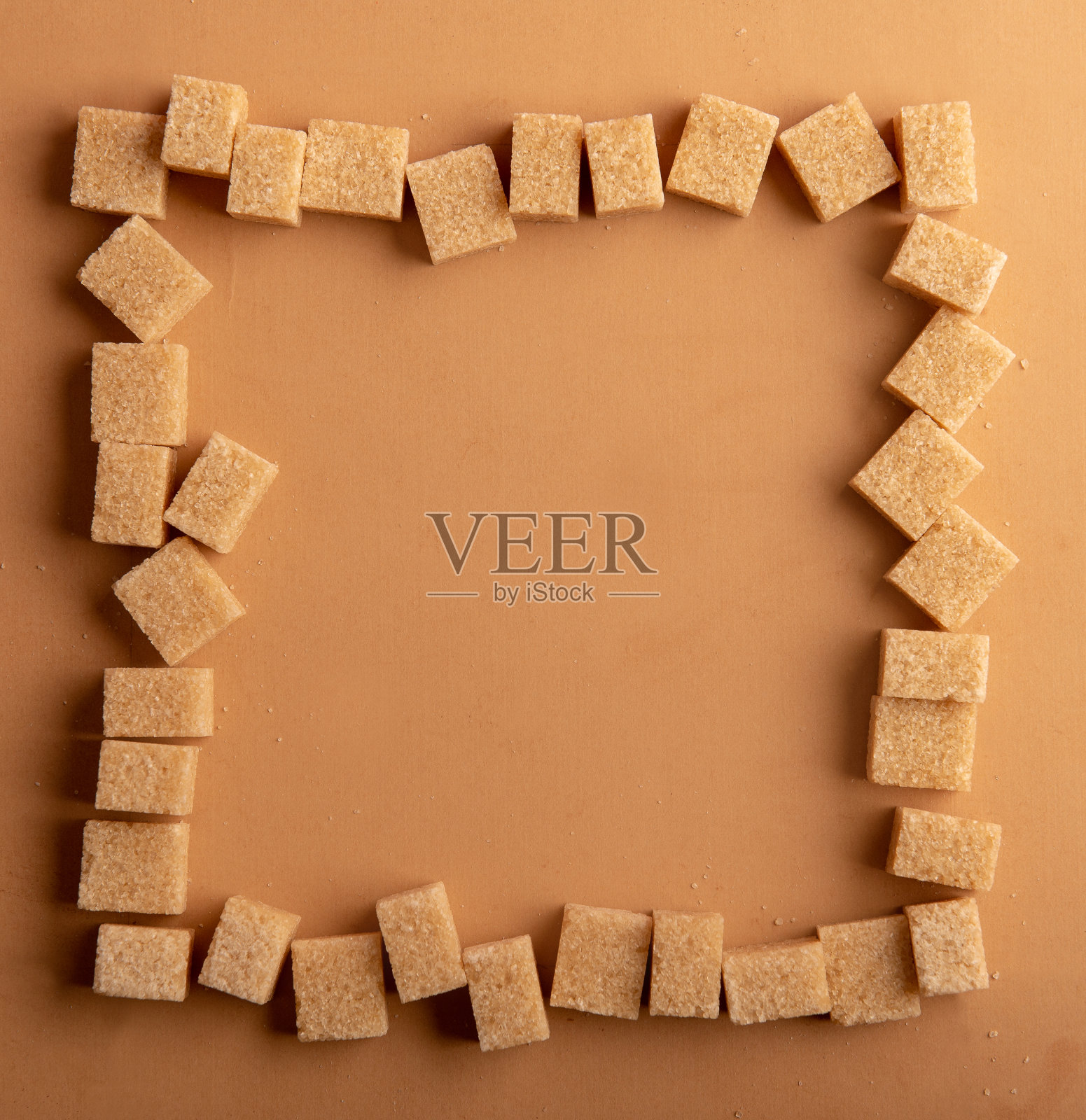 棕色背景的方糖照片摄影图片