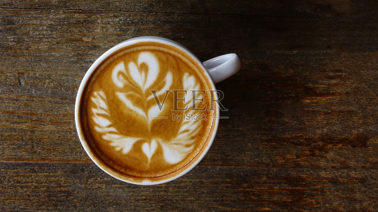 一杯拉花咖啡照片摄影图片