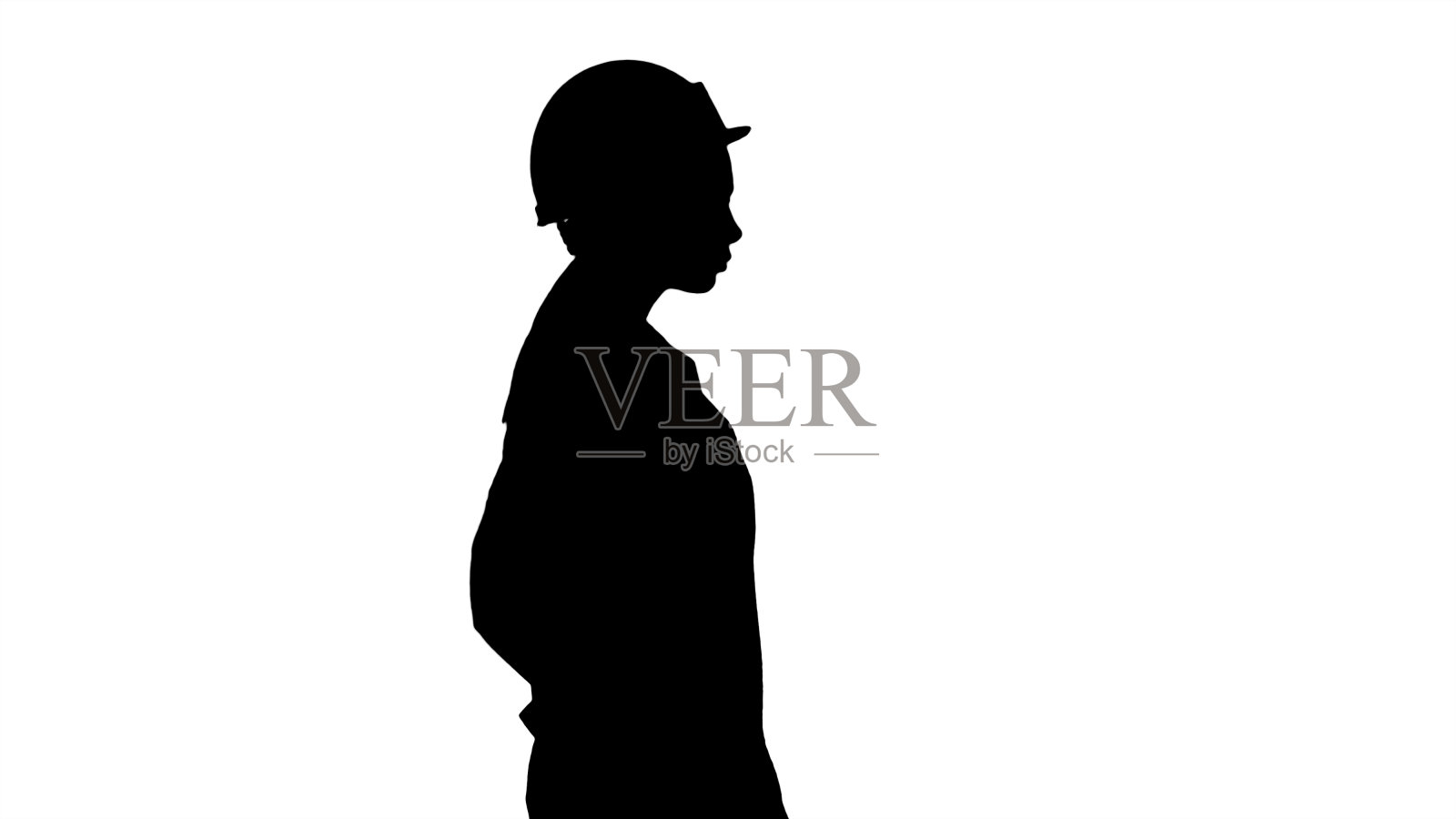 剪影女子在白色长袍戴上安全帽行走照片摄影图片