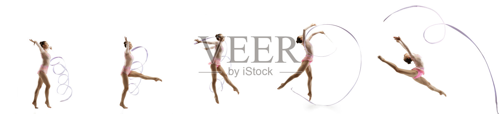 柔顺的小女孩孤立在白色的工作室背景上。穿着鲜艳紧身衣的小女子艺术体操艺术家照片摄影图片