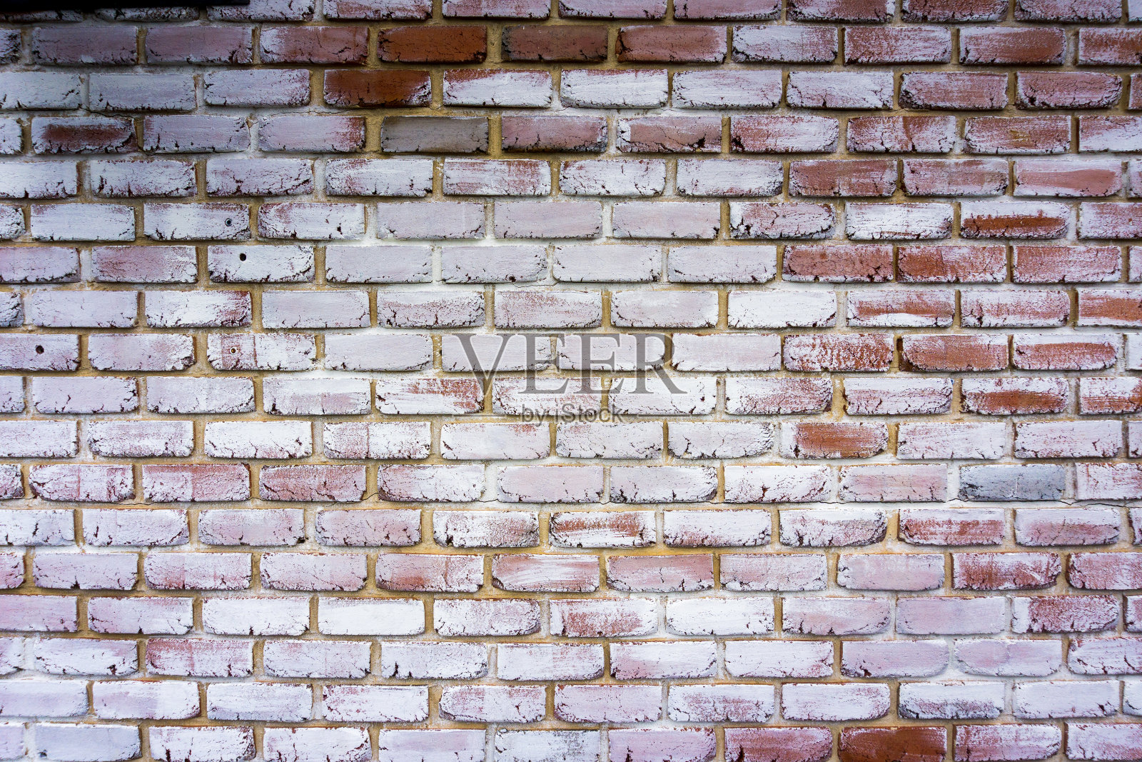 红色砖墙的背景漆成白色。砖瓷砖纹理照片摄影图片