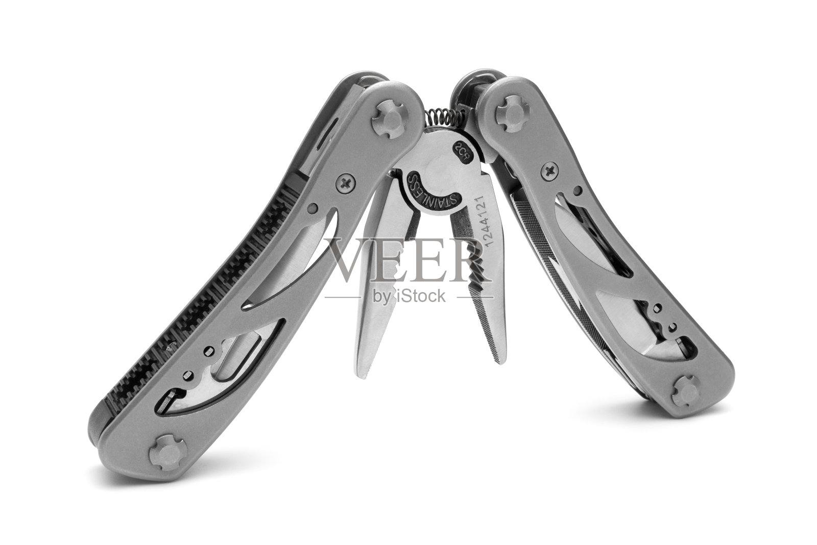 半折叠多工具与钳子在一个白色的背景照片摄影图片