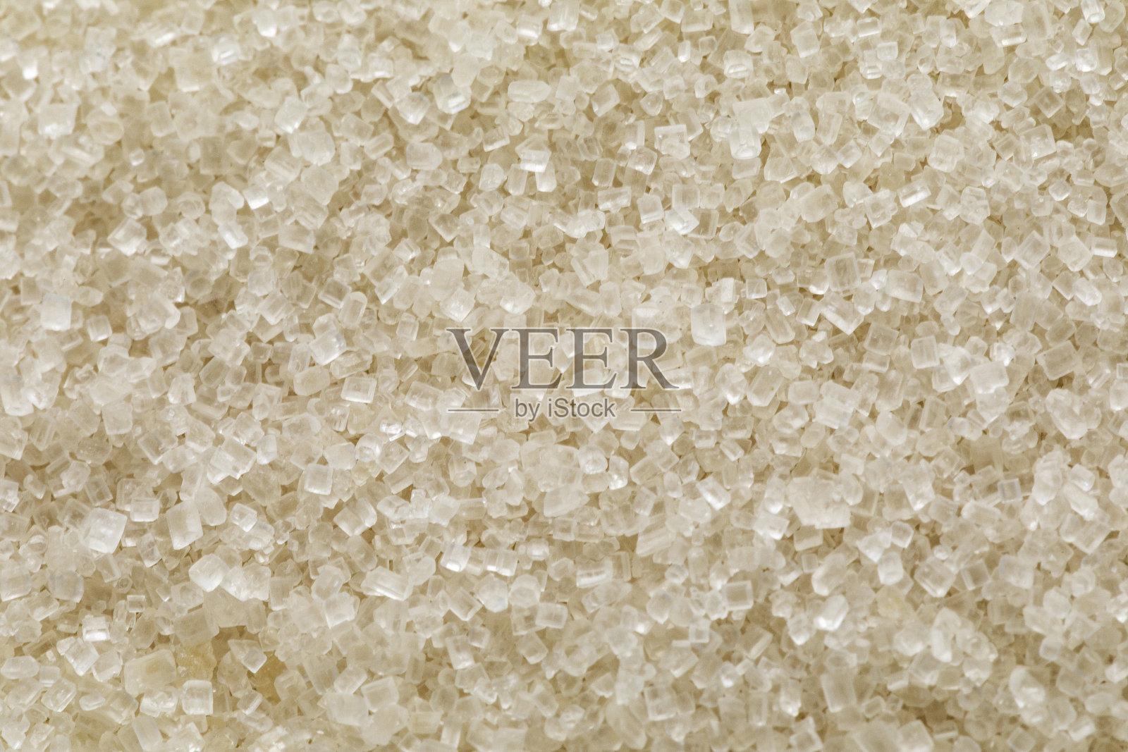 白色背景上结晶糖粒的纹理。照片摄影图片