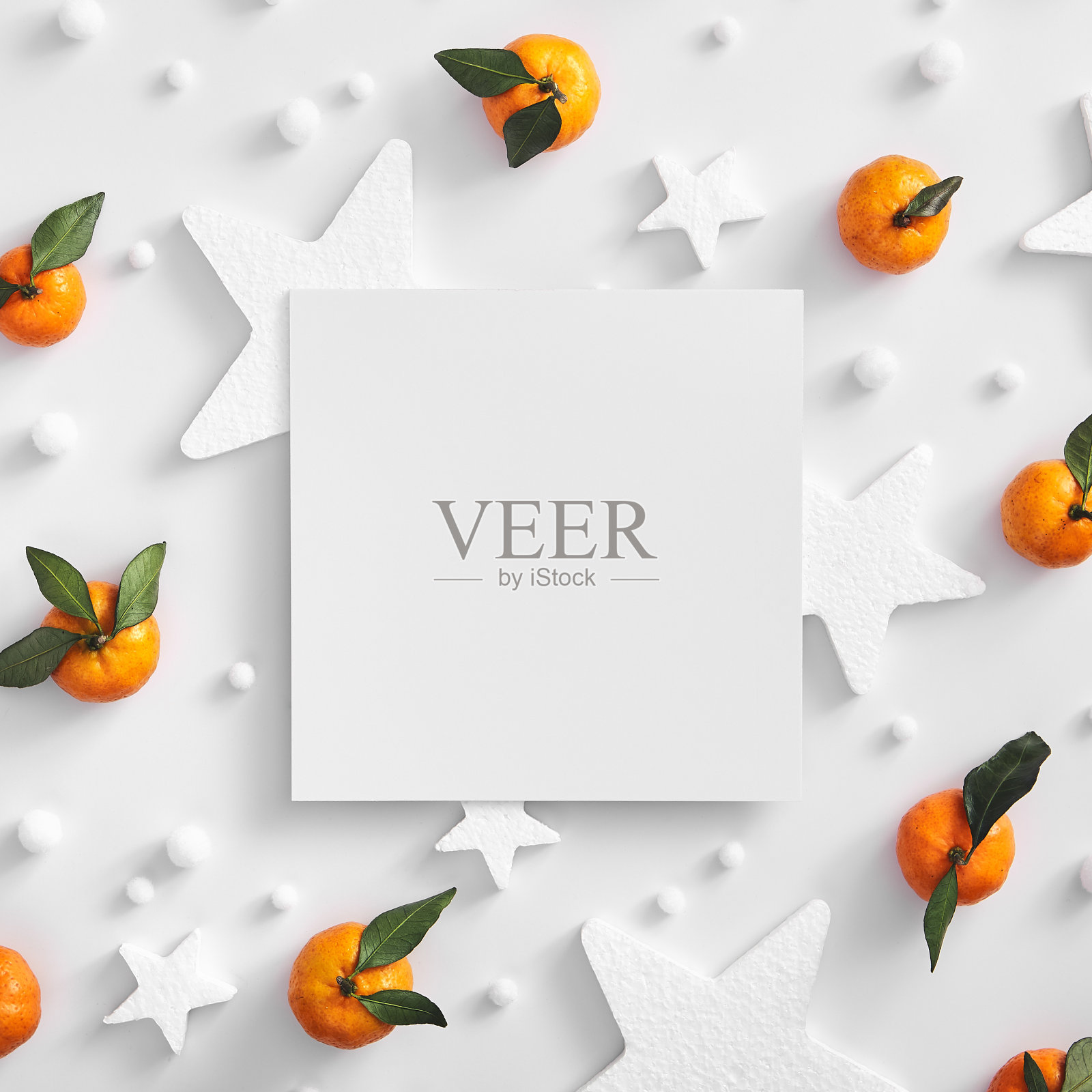 白色的星星和橘色的纸照片摄影图片