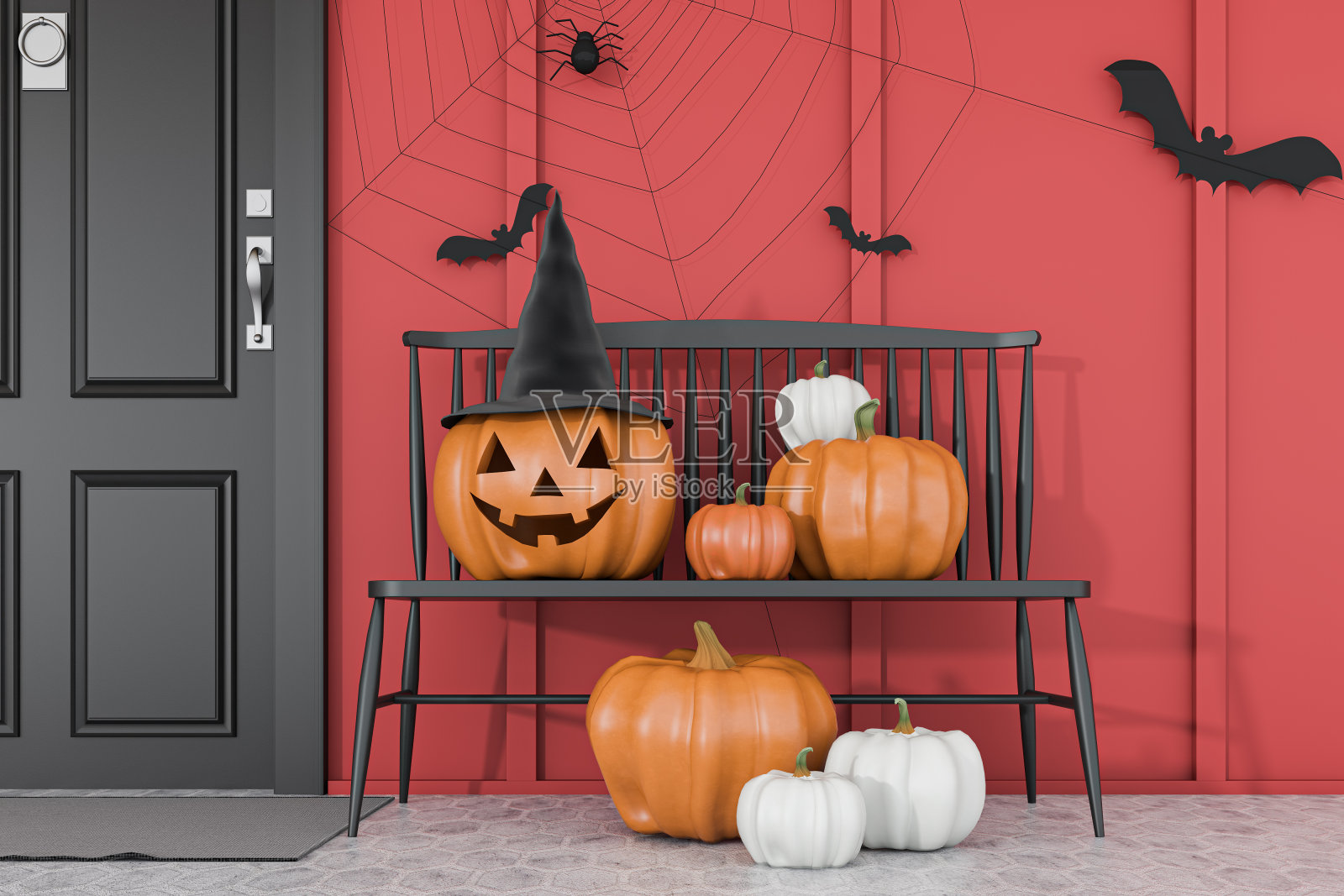 在红房子附近的长凳上雕刻南瓜照片摄影图片