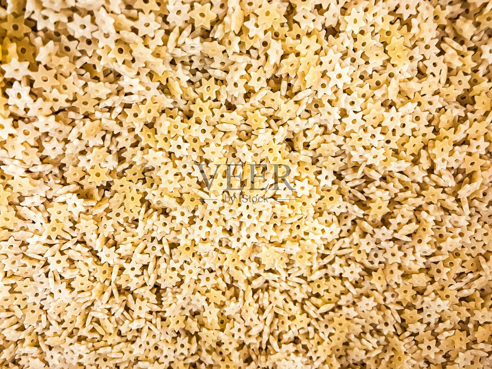 特写大量粘贴小星星，星号(星号)作为背景照片摄影图片