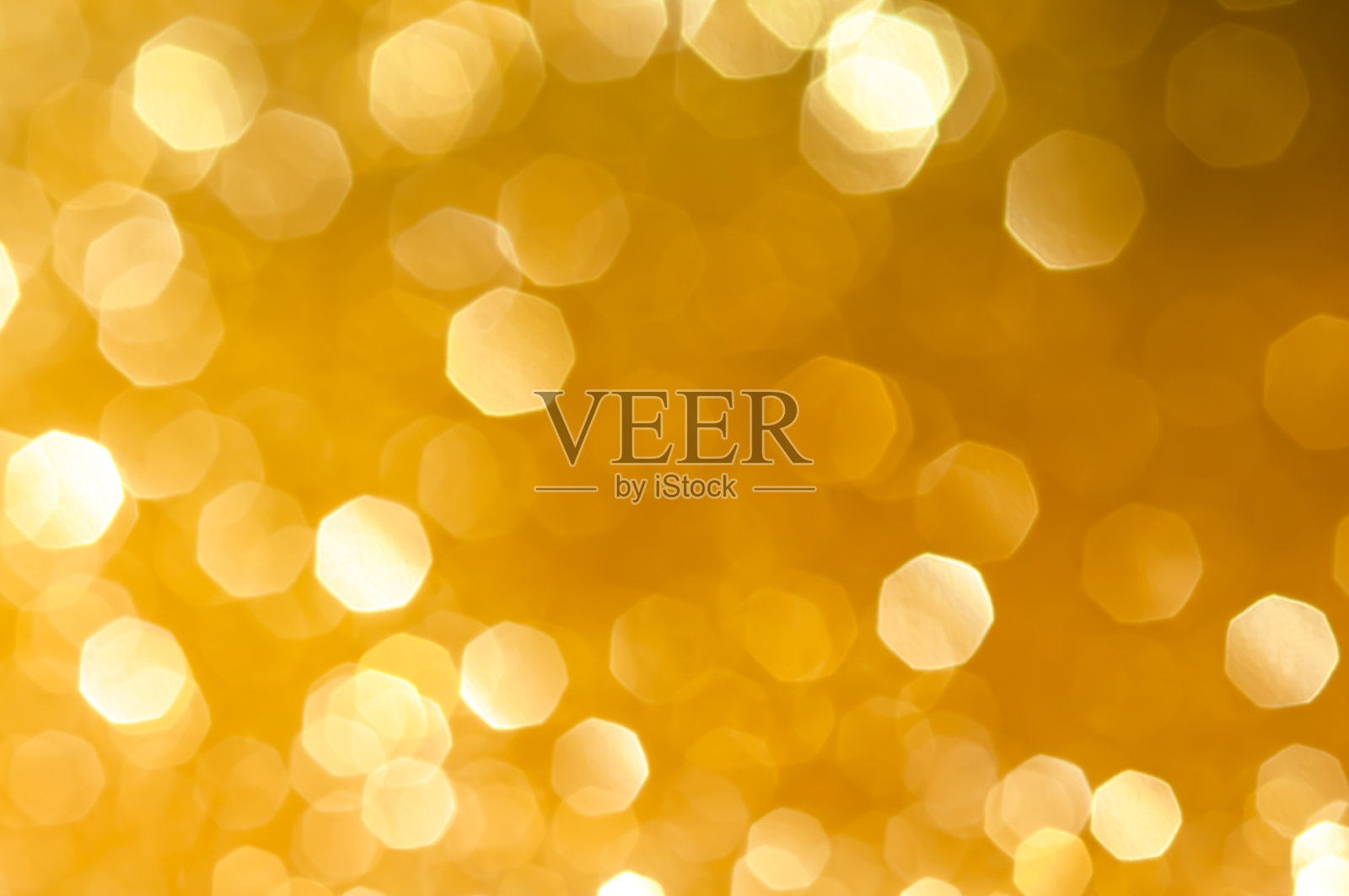 抽象的散景白色，淡黄色金色的圆形背景。夜灯季节问候优雅的背景或艺术品设计新年，圣诞节闪闪发光或特别的日子。照片摄影图片