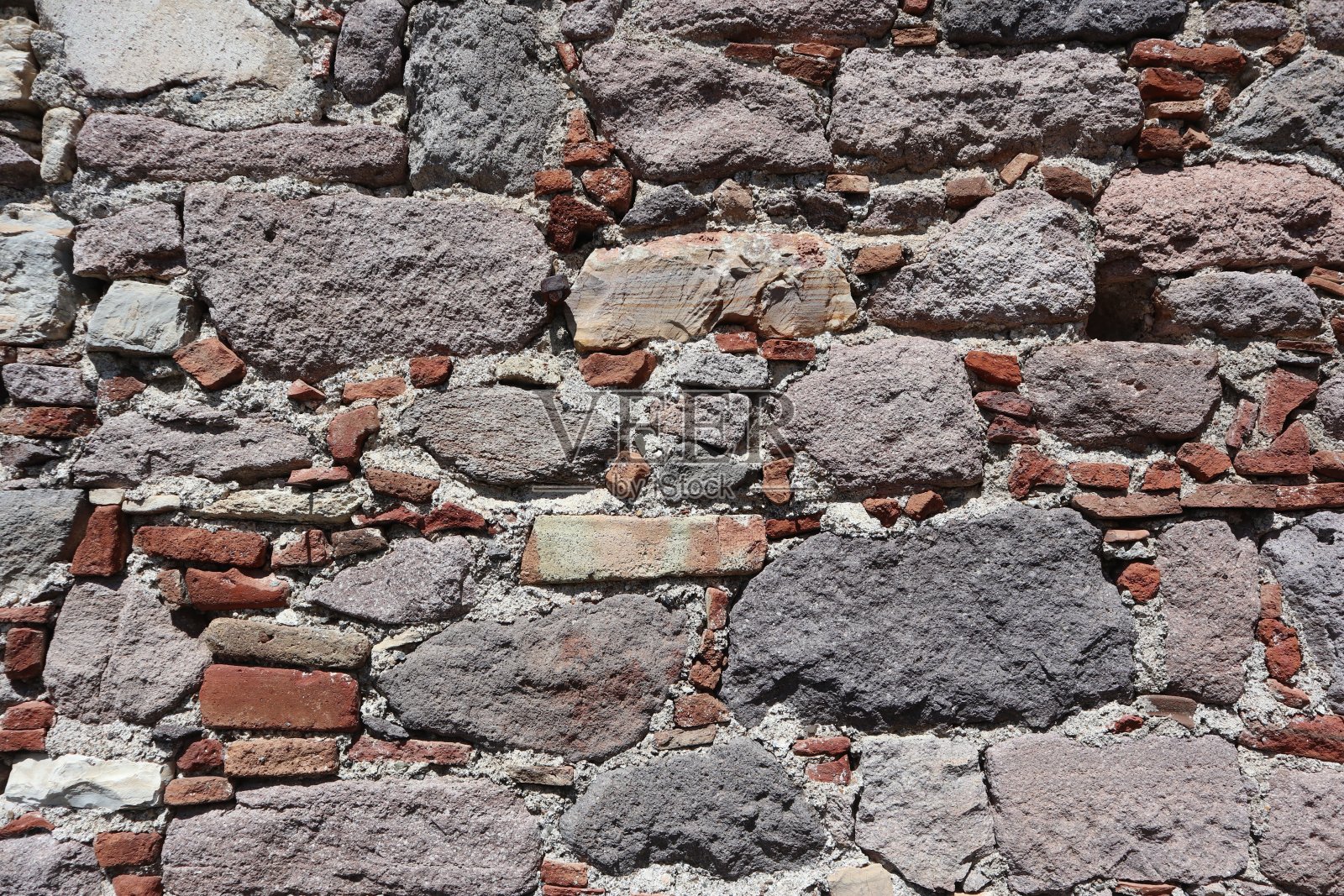 粗糙的砖砌的。石头的背景照片摄影图片