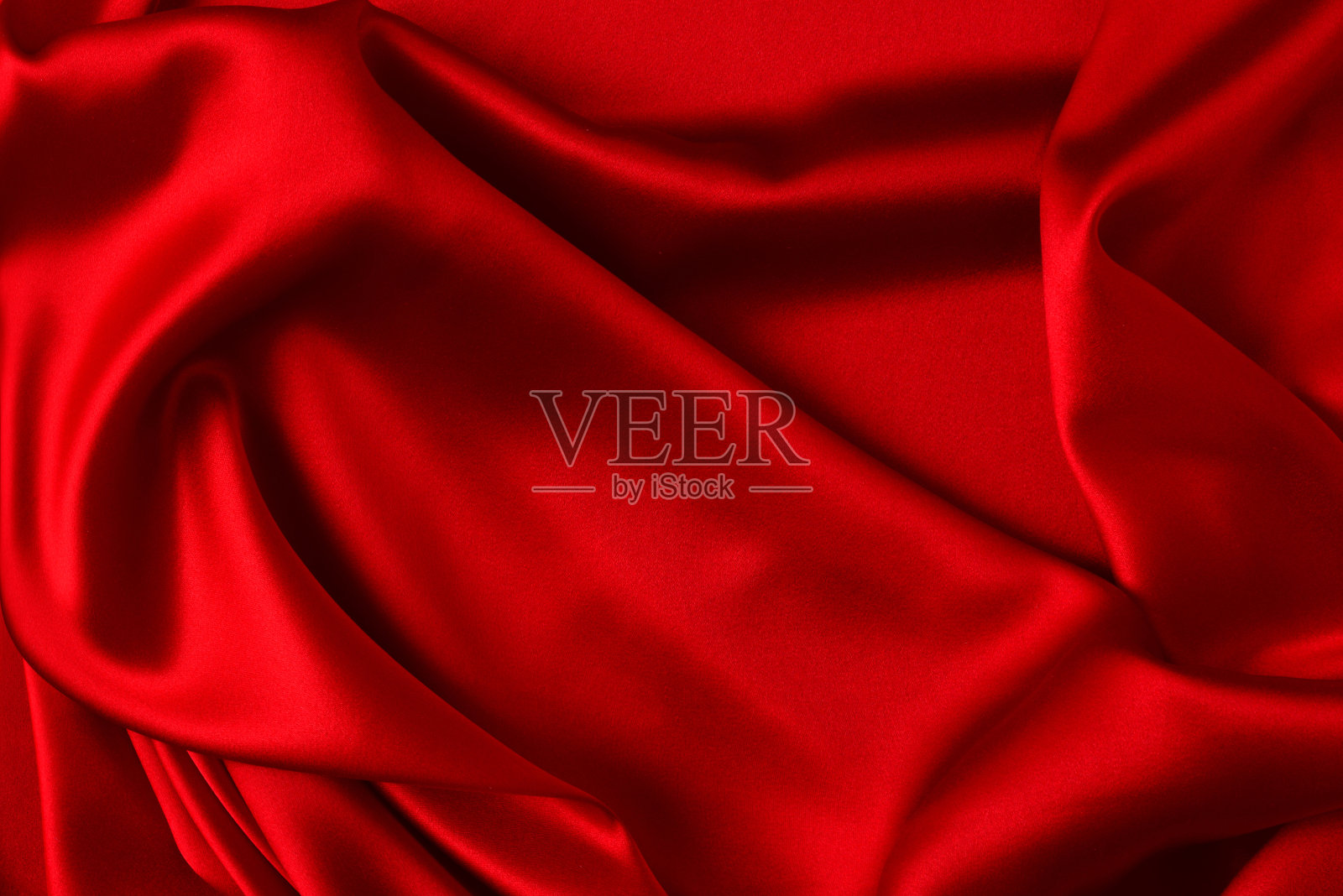 红色丝绸或豪华缎纹织物可作为抽象背景。俯视图照片摄影图片