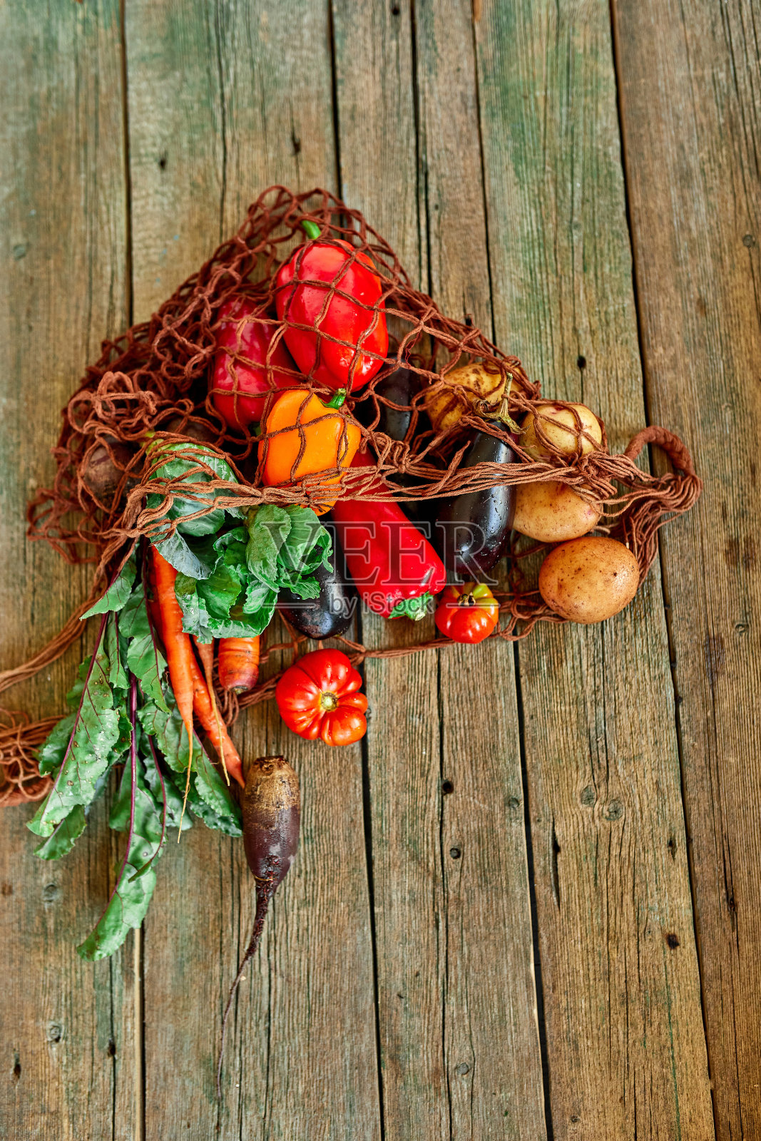 平铺环保绳购物可重复使用的网袋与各种新鲜蔬菜照片摄影图片