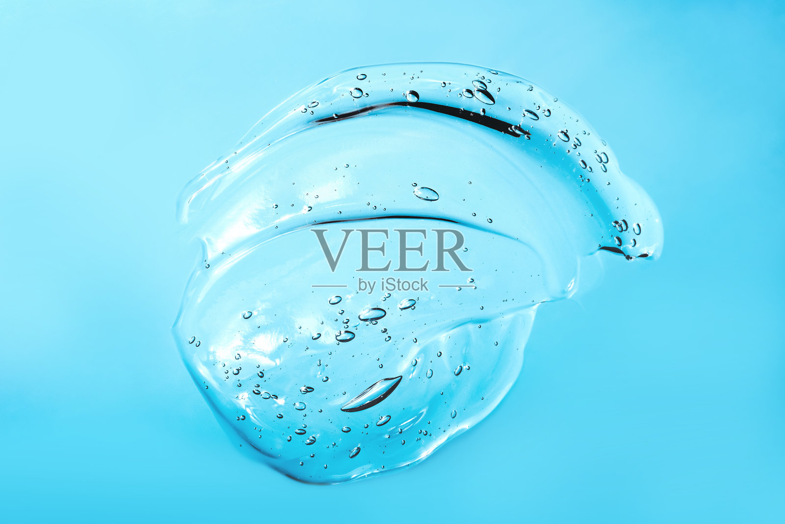 化妆品霜透明液体凝胶的血清纹理与微气泡照片摄影图片