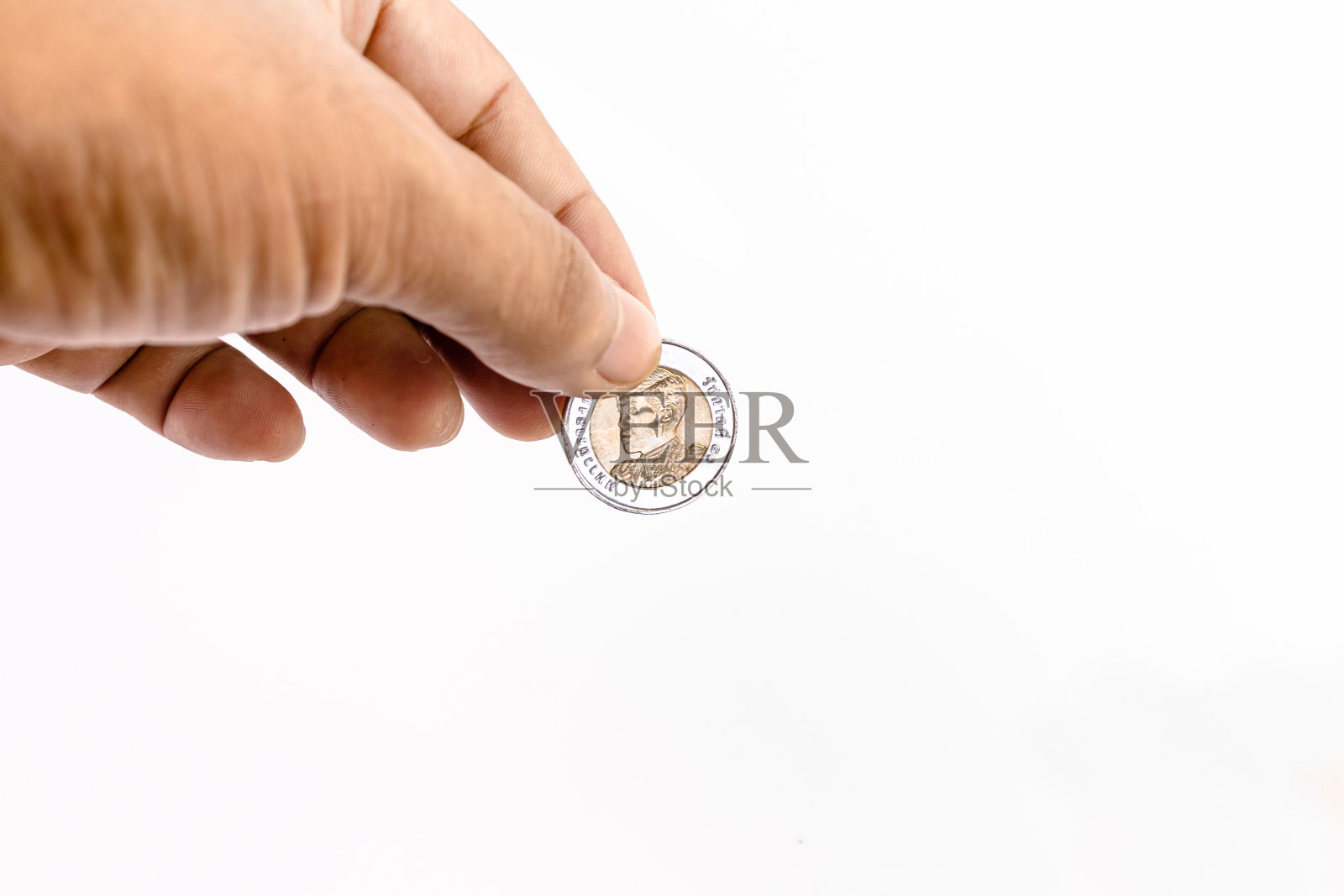 10泰铢币在手握，为企业省钱理财理念，拷贝空间照片摄影图片