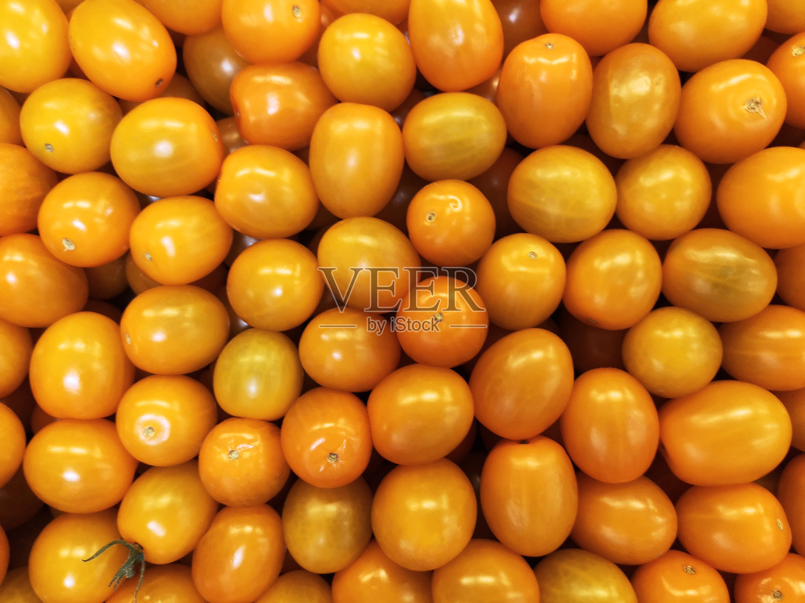 黄番茄背景。一组新鲜的西红柿。樱桃番茄的背景照片摄影图片