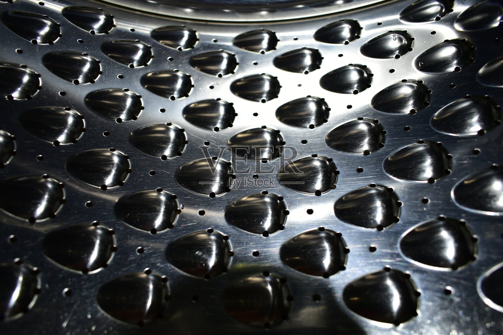 洗衣机滚筒的内表面照片摄影图片