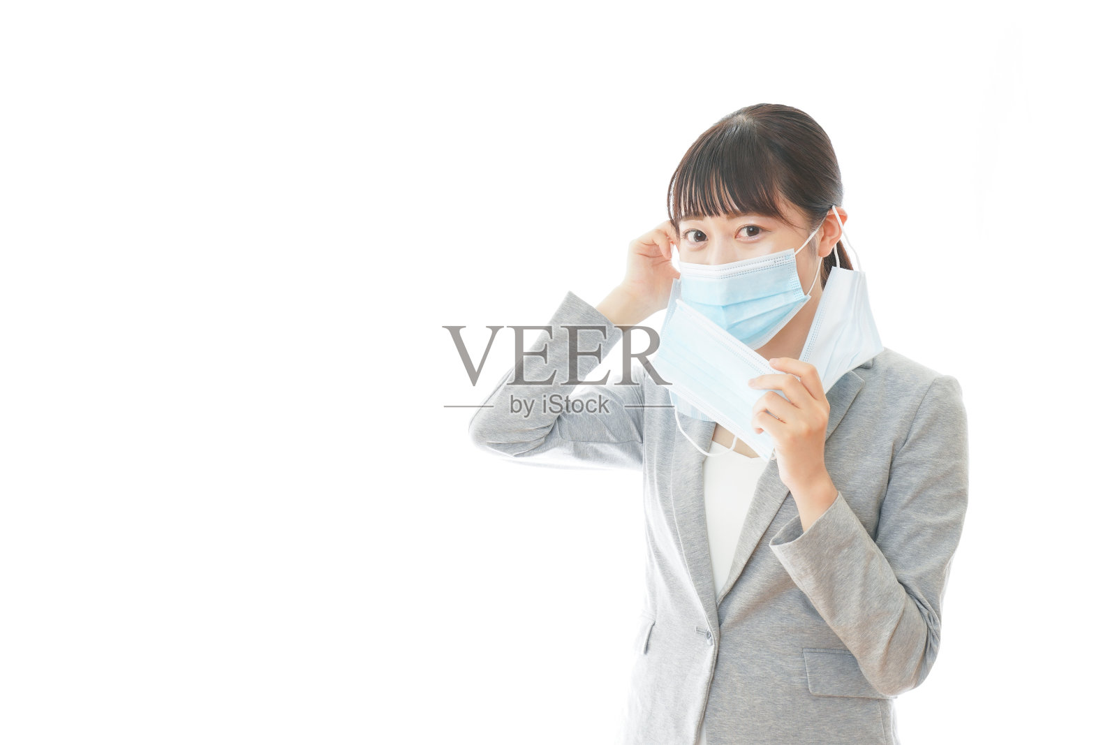 年轻的商人戴着大量的面具照片摄影图片