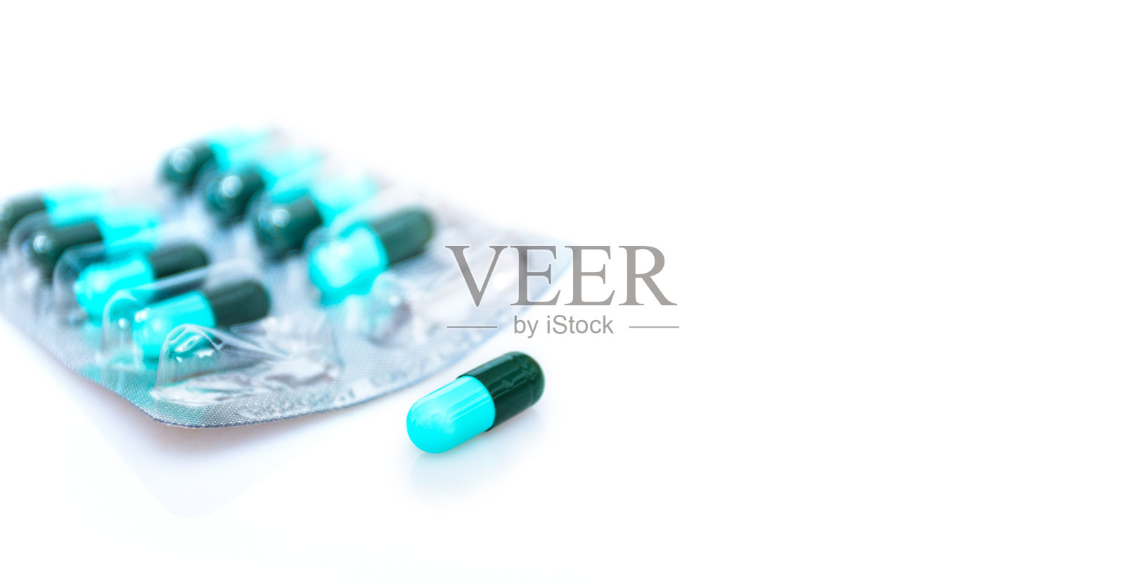 药胶囊面板上的白色背景照片摄影图片