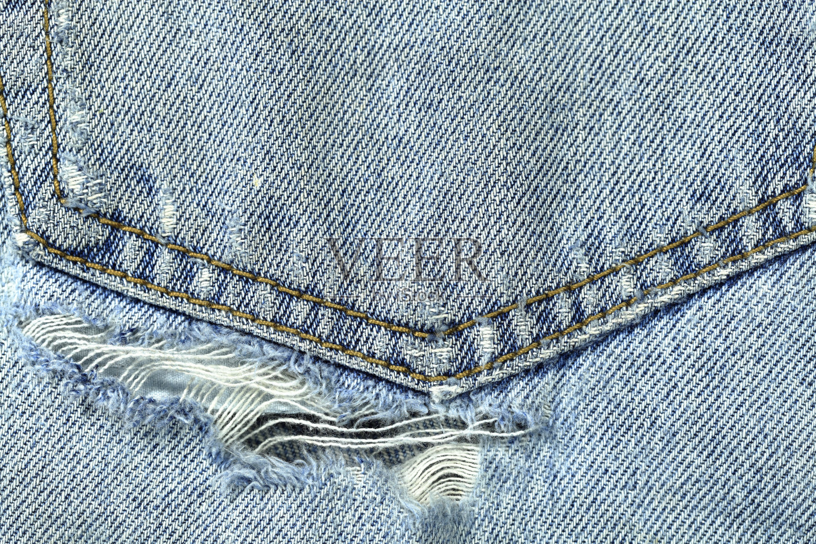 口袋磨损的旧的破旧的牛仔牛仔裤照片摄影图片