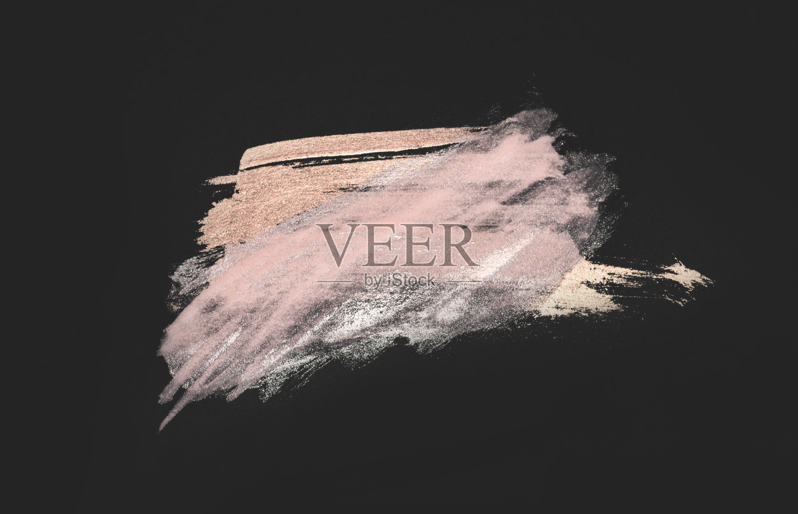 抽象的金色和粉色手绘污渍在黑色的背景照片摄影图片