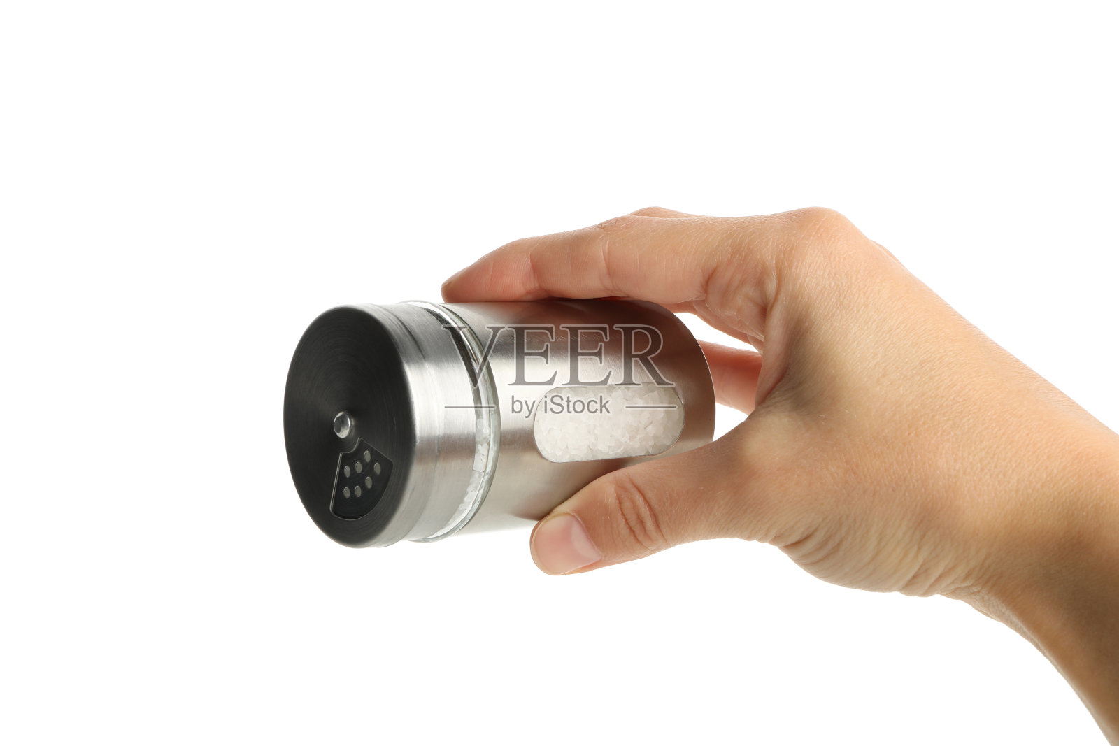 女性手握盐瓶，孤立在白色背景上照片摄影图片