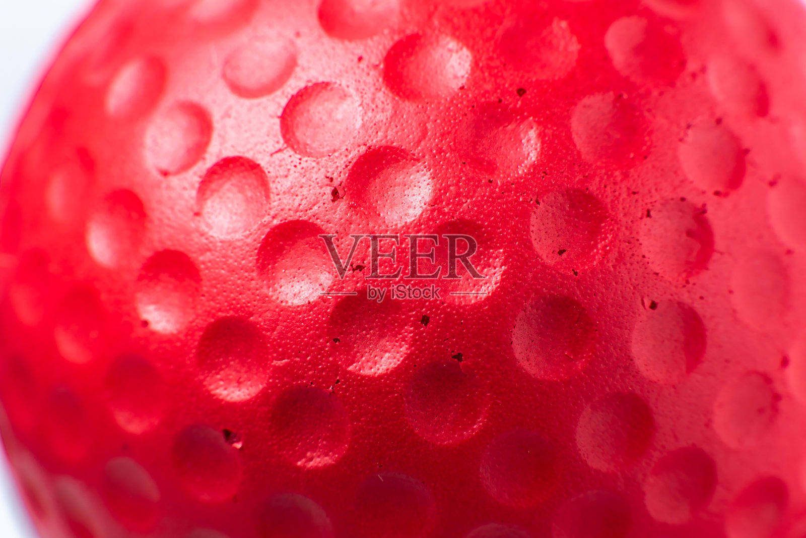 红色橡胶球质地。关闭背景。照片摄影图片