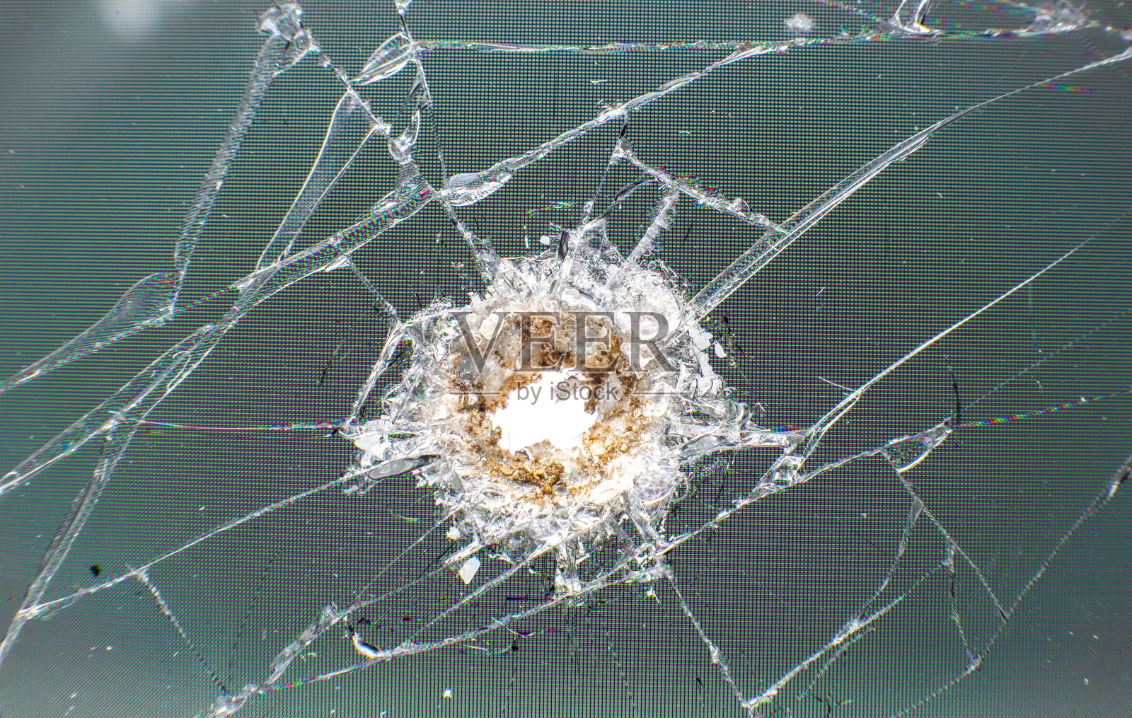 子弹留下的碎玻璃。特写照片纹理。照片摄影图片