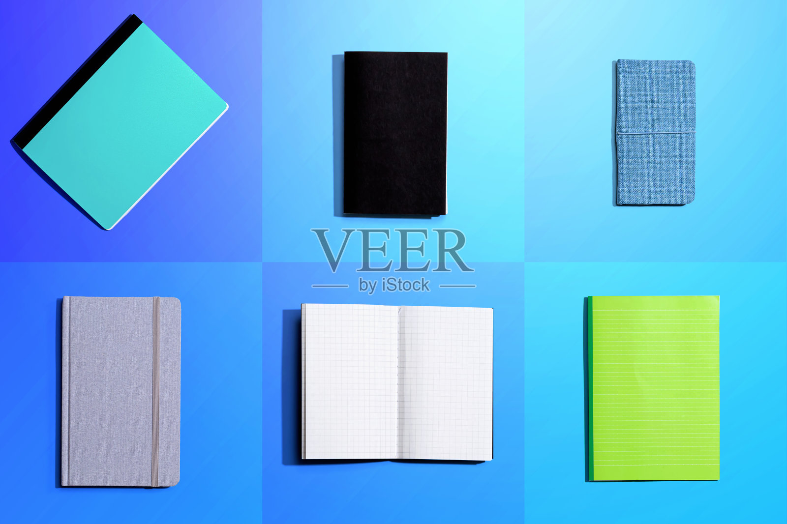 从上面把笔记本放在铺了瓷砖的桌子上照片摄影图片