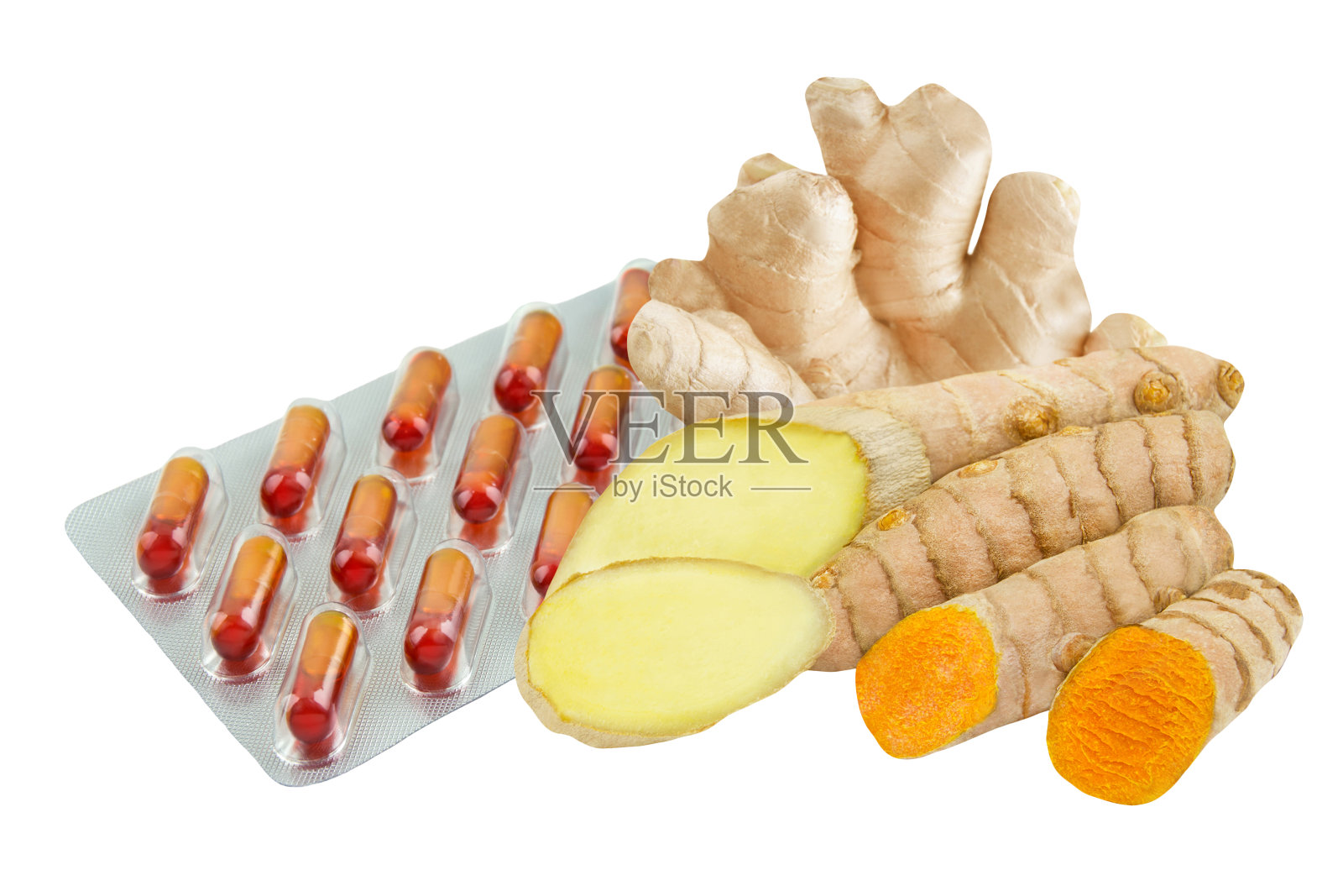 在白色背景下分离的姜黄和生姜根胶囊照片摄影图片