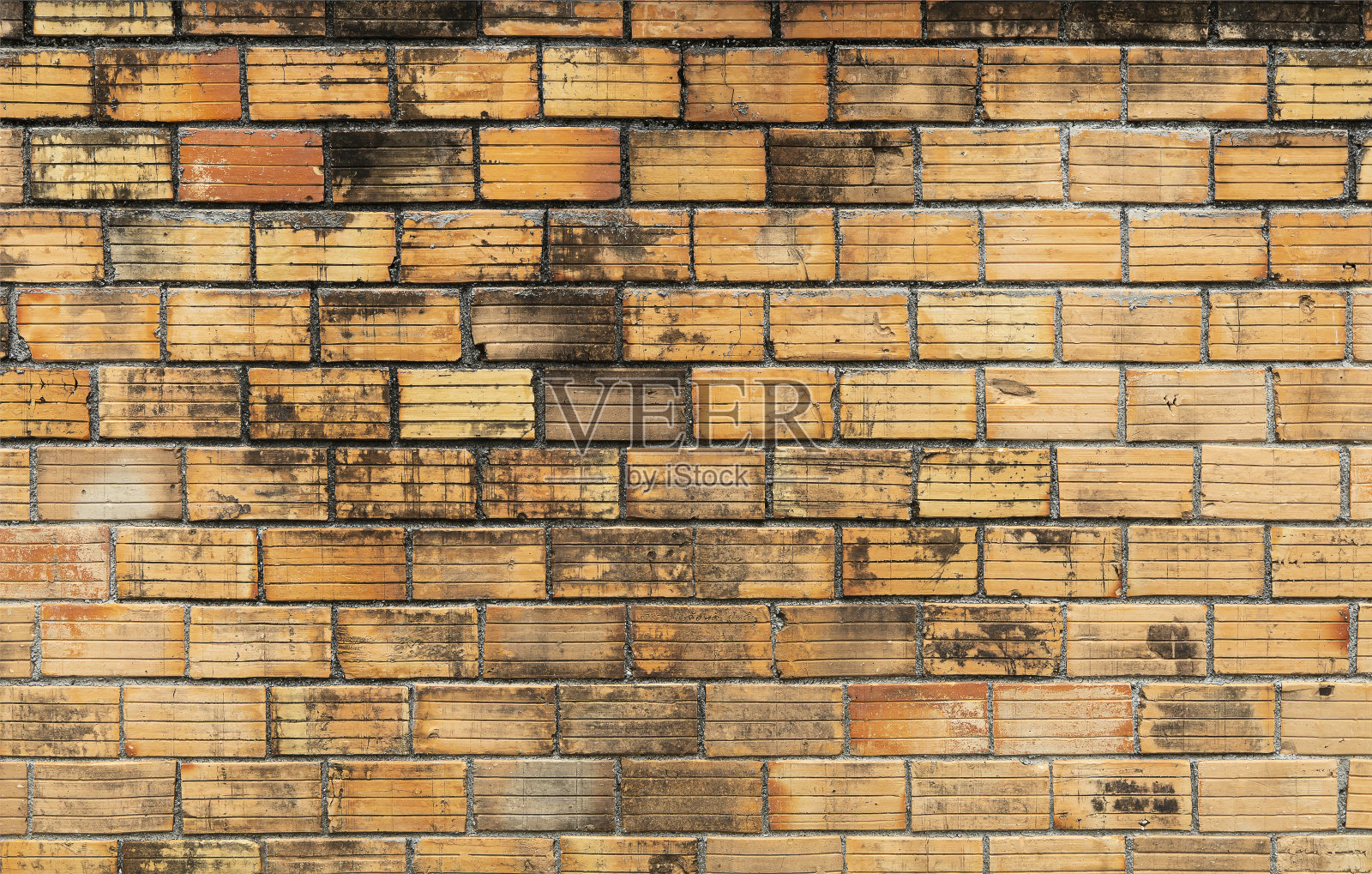 红砖墙没有抹灰的背景。旧砖墙很脏。照片摄影图片