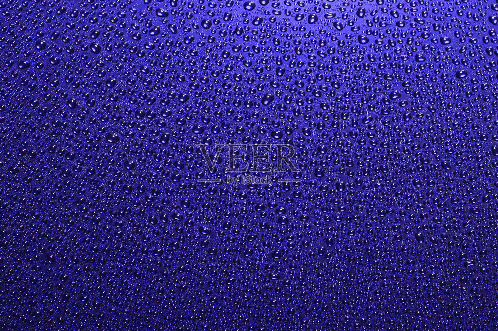 蓝色背景和水滴照片摄影图片