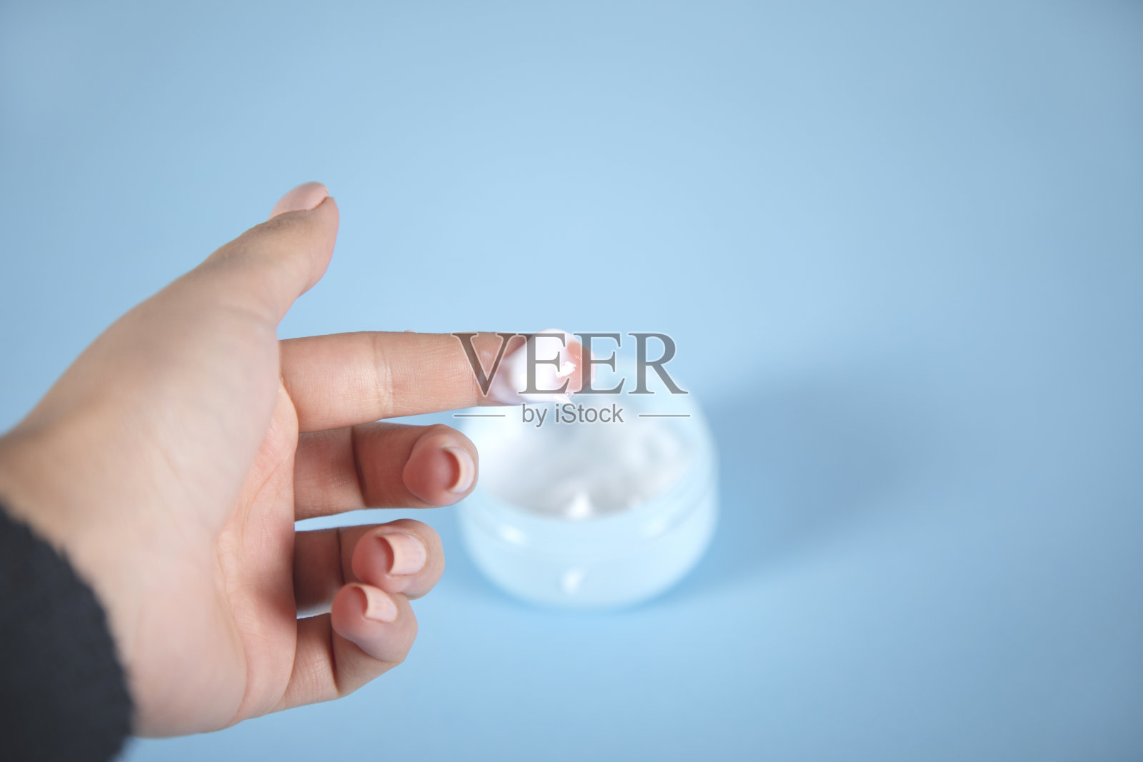 女人的手指奶油照片摄影图片