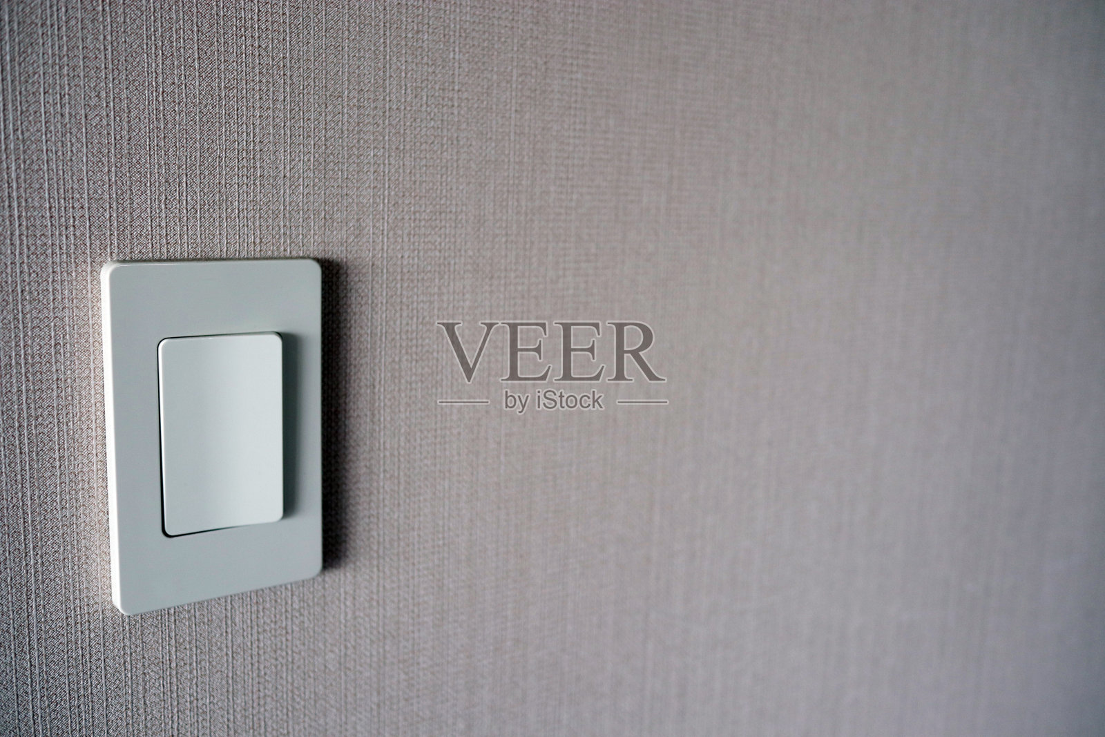 白色的电灯开关照片摄影图片